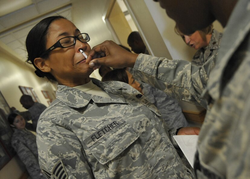 Staff Sgt. Chaya Fletcher, 51st Fighter Wing, receives the FluMist NasalSpray Flu Vaccine at Osan Air Base, Republic of Korea Aug. 17. The FluMistis a live virus vaccine which is available for all military personnel at the51st Medical Hospital. The 51st Medical Group is sending mobile teams aroundOsan in an effort to expedite the vaccination process. Their goal is to have90 percent of the base population vaccinated by the end of the week. (U.SAir Force Photo/Senior Airman Evelyn Chavez)