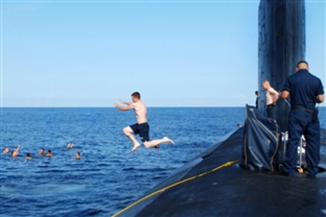 U.S. Naval Academy midshipmen and sailors assigned to the Virginia-class attack submarine USS Virginia participate in a swim call in the Atlantic Ocean, Aug 16, 2010. The midshipmen are aboard Virginia for a first-hand experience of the inner-workings of the submarine and the submarine community.
