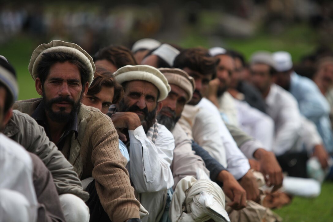 Pakistani civilians wait to board a CH-53E Super Stallion helicopter during humanitarian relief efforts in the Khyber-Pakhtunkhwa province, Pakistan(formerly known as the Northwest Frontier province, Pakistan).