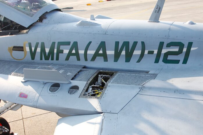 The Marine noncommissioned sword is emblazed on the port side of the Marine All-Weather Fighter Attack Squadron 121 flag plane to represent the enlisted personnel who maintain the aircraft for mission readiness.