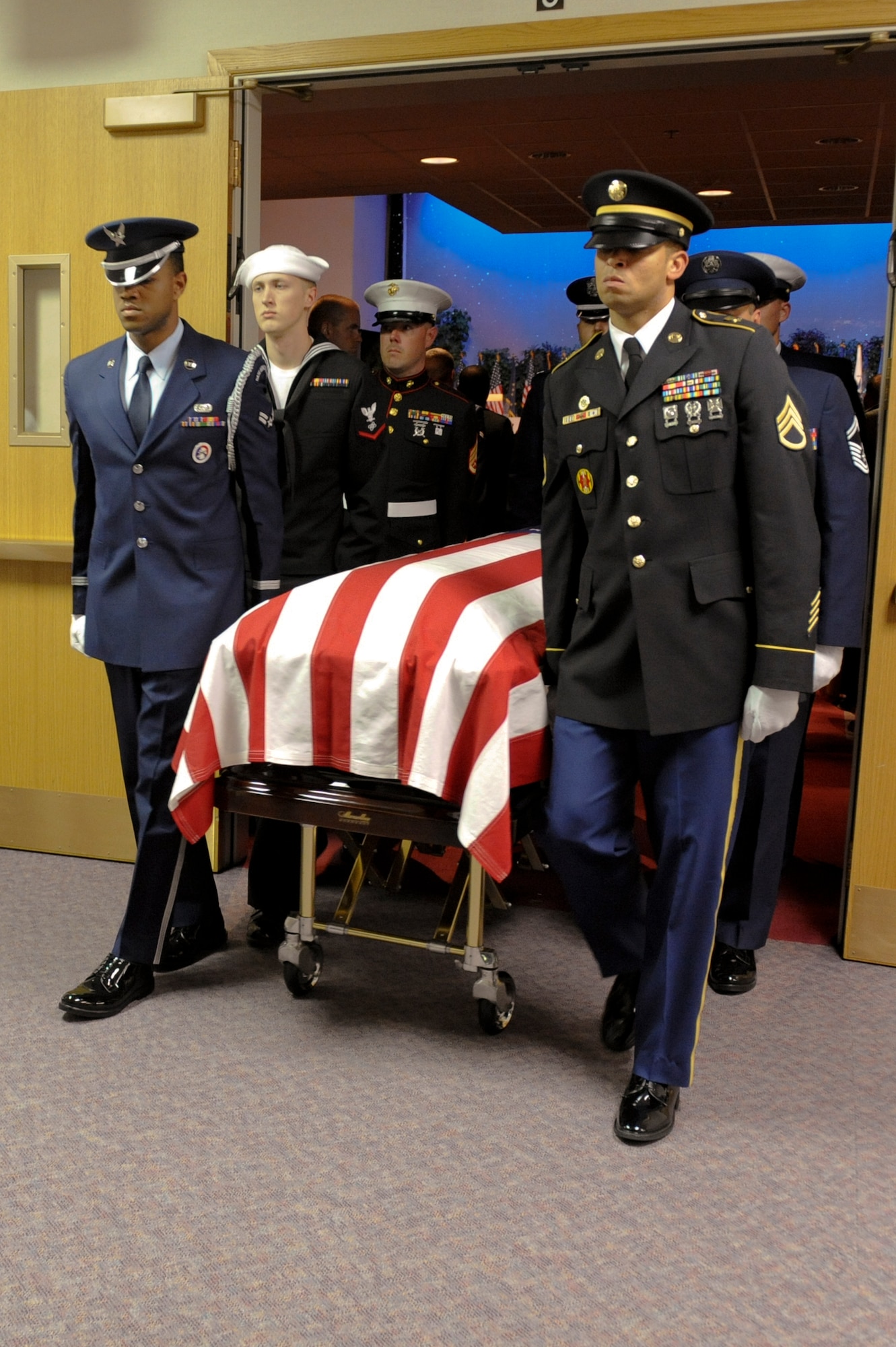 ANCHORAGE, Alaska -- The joint service honor guard detail escorts the body of former Sen. Ted Stevens after the memorial service for the senator ended. Sen. Stevens is to be buried in Arlington National Cemetery, Va.  (U.S. Air Force Photo by Staff Sgt. Joshua Garcia) 
