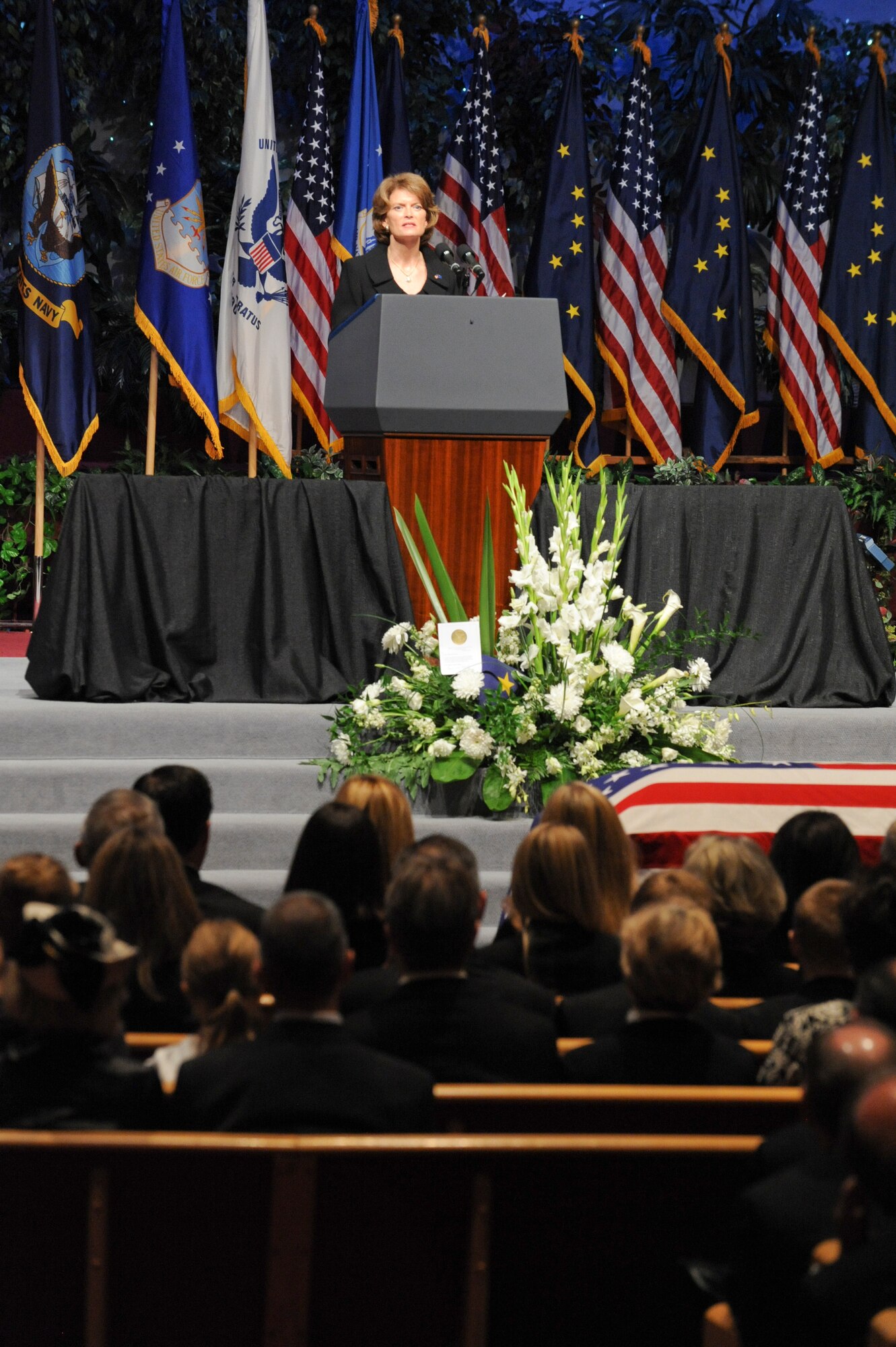 ANCHORAGE, Alaska -- Alaska Sen. Lisa Murkowski reads the poem "A Legacy of Dreams," by Dr. William Ransom Wood, during the memorial service for former Alaska Sen. Ted Stevens. The senator was personally asked by the family to read the poem during the ceremony which was attended by the local military and civilian community alongside many political dignitaries. (U.S. Air Force Photo by Staff Sgt. Joshua Garcia) 