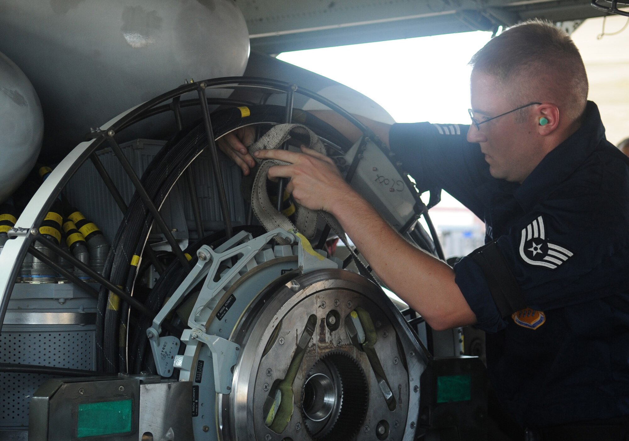 Staff Sgt. Daniel Santell, member of the 2d Aircraft Maintenance Squadron weapons load crew, helps load a trainer cruise missile onto a B-52H Stratofortress during the weapons load portion of the Global Strike Challenge Aug. 17. More than 400 Airmen from 2d Bomb Wing and B-52 Stratofortress were able to compete in this year?s challenge. (U.S. Air Force photo/Senior Airman Amber Ashcraft) (RELEASED)