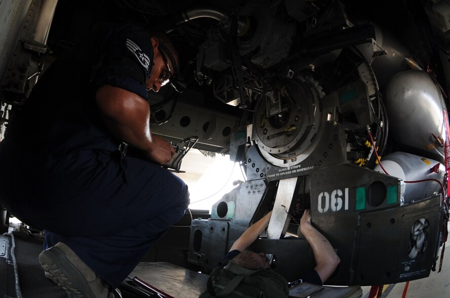 BARKSDALE AIR FORCE BASE, La. - Staff Sgt. Daniel Santell and Staff Sgt. Jose Baez-Sauri, 2d Aircraft Maintenance Squadron weapons load crew member follow the steps necessary to load trainer cruise missiles onto a B-52H Stratofortress during the Global Strike Challenge Aug. 17. The competition itself consisted of a test in knowledge of Air Force Instruction and technical data, dress and appearance, pre-flight inspection, trainer weapons loads and a buildup of munitions. (U.S. Air Force photo by Senior Airman Brittany Y. Bateman)(RELEASED)