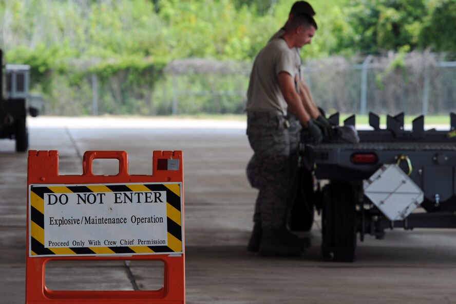 BARKSDALE AIR FORCE BASE, La. -- Airmen from the 2d Munitions Squadron participate in the Global Strike Challenge Aug. 17. The competition itself consisted of a test in knowledge of Air Force Instructions and technical data, dress and appearance, pre-flight inspection, trainer weapons loads and a buildup of munitions. (U.S. Air Force photo by Senior Airman Brittany Y. Bateman)(RELEASED) 
