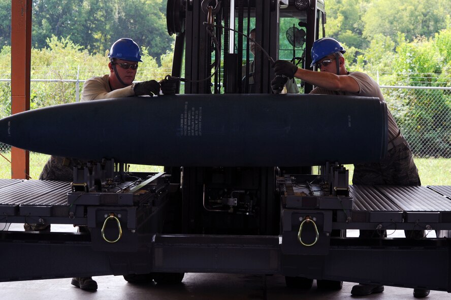 BARKSDALE AIR FORCE BASE, La. - Airmen from the 2d Munitions Squadron unhooks a weapon from a forklift during the Global Strike Challenge Aug. 17. As many as 400 Airmen are competing, including Airmen from Air Force Global Strike Command, Air Combat Command and the Air Reserve Component. (U.S. Air Force photo by Senior Airman Brittany Y. Bateman)(RELEASED)