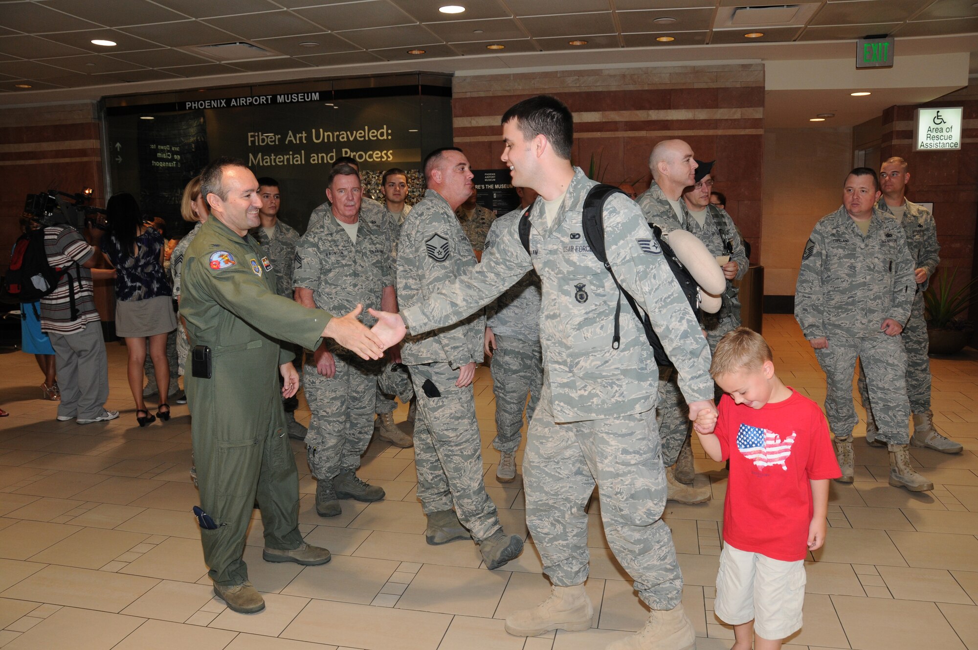 U.S. Air Force Staff Sgt. Nathan Graham, assigned to the 161st Air Refueling Wing Security Forces Squadron, Phoenix Ariz., is welcomed home by Colonel Steven Balser, 161st Air Refueling Wing Commander.  Staff Sgt. Graham returned home following a six month deployment to Kyrgyzstan in support of Operation Enduring Freedom on August 18, 2010. (U.S. Air Force photo by Master Sgt. Kelly Deitloff)