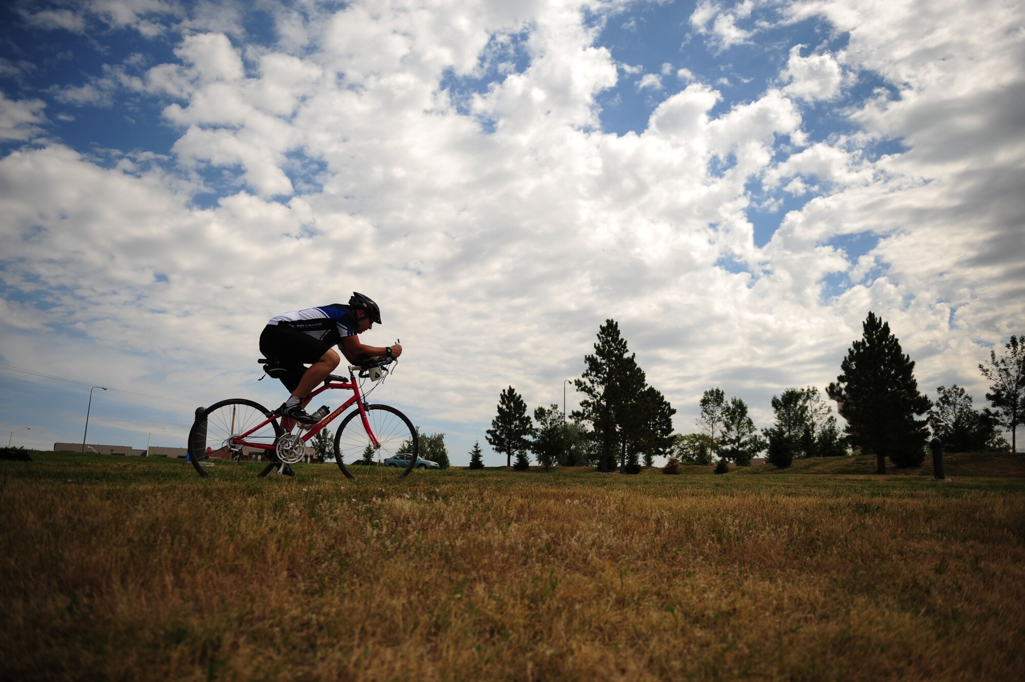 ELLSWORTH AIR FORCE BASE, S.D. – Tech. Sgt. Kory Lindsey, 28th Operations Support Squadron air traffic control journeyman, rides his bicycle, August 16. Sergeant Lindsey will participate in a ride that will raise money for a cure for multiple sclerosis. His goal is to better the life of a close family member and others who are affected by the disease. (U.S. Air Force photo/Senior Airman Corey Hook)
