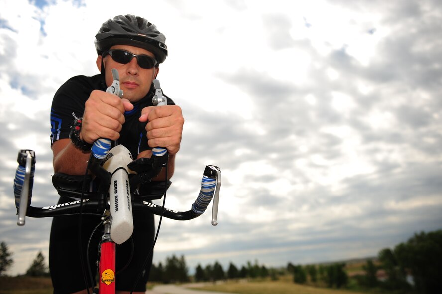 ELLSWORTH AIR FORCE BASE, S.D. – Tech. Sgt. Kory Lindsey, 28th Operations Support Squadron air traffic control journeyman, sits on his bicycle, August 16. Sergeant Lindsey will participate in a ride that will raise money for a cure for multiple sclerosis. MS is a disease that can affect the way a person sees, feels and interacts with the world. (U.S. Air Force photo/Senior Airman Corey Hook)