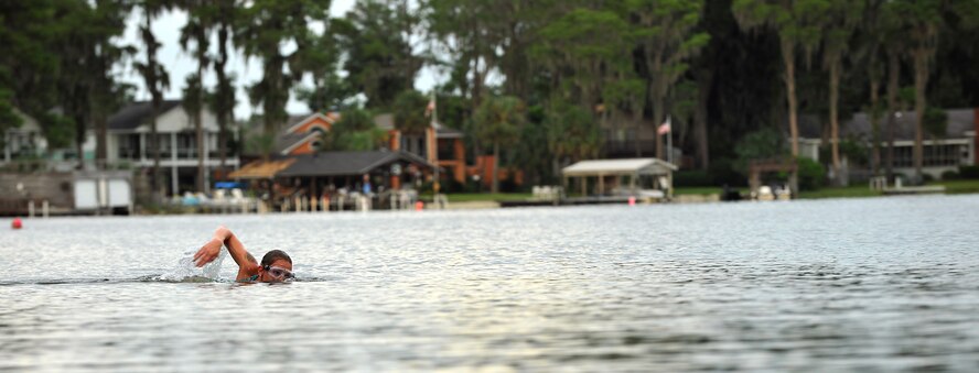 Lake Park, Ga. -- Amanda Merck, wife of Staff Sgt. Paul Merck, 38th Rescue Squadron survival, evasion, resistance and escape specialist from Moody Air Force Base, Ga., swims toward a buoy in preparation for an upcoming triathlon event here Aug. 18. Mrs. Merck said, “I like swimming because it provides a good cardiovascular workout and physical challenge.”  (U.S. Air Force photo/Airman 1st Class Joshua Green)