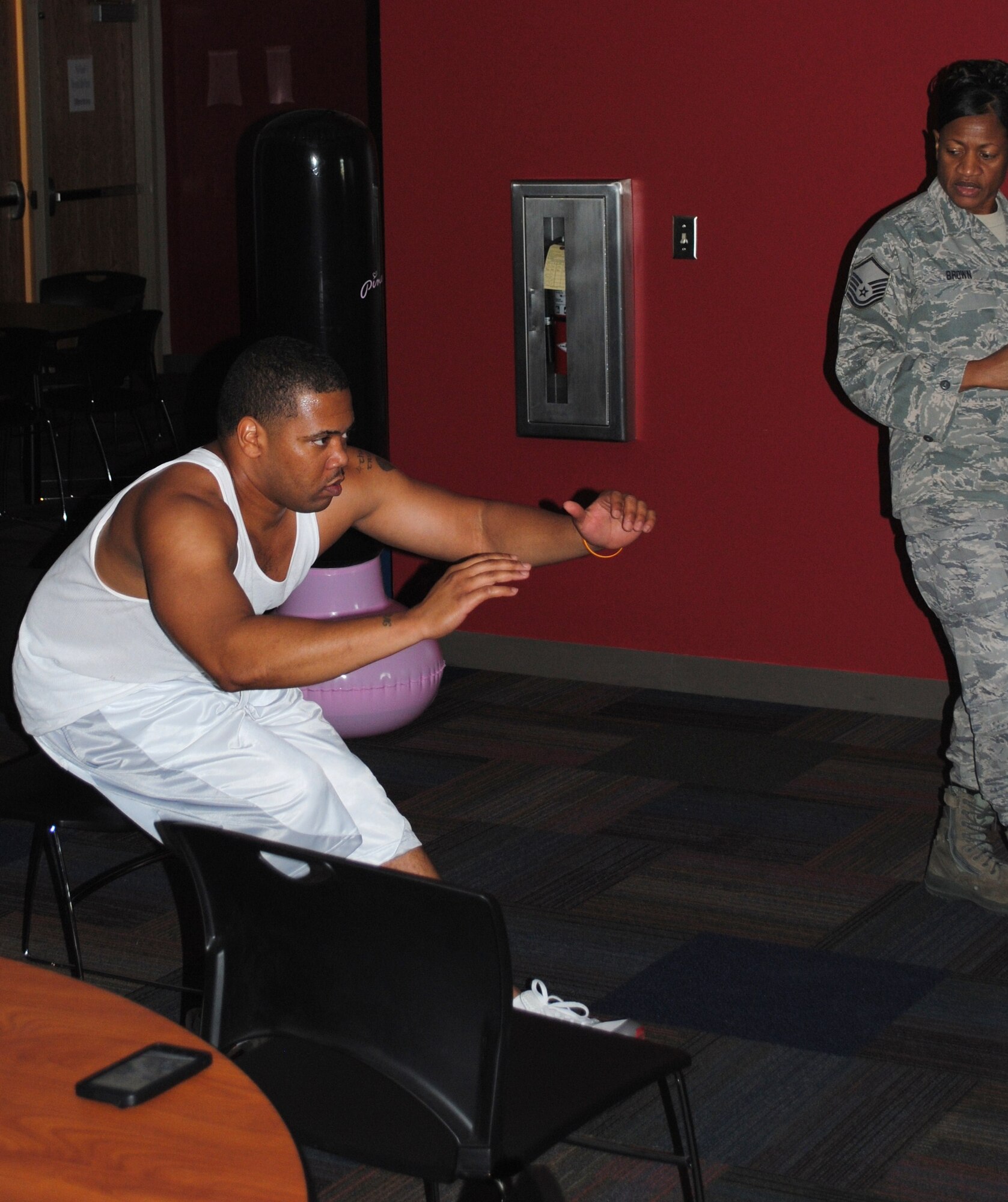 A member of the 164th Airlift Wing improves leg and core strength during "Boot Camp" workout.