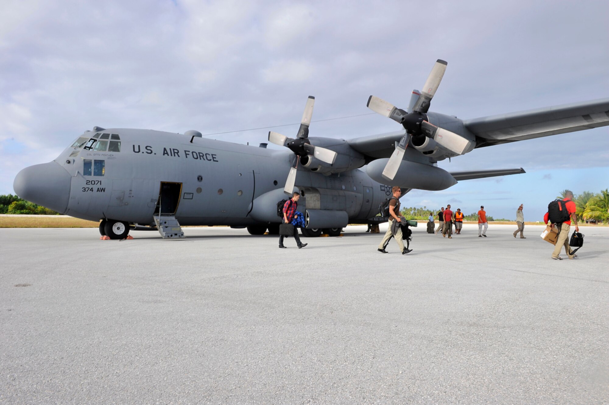 U. S. military members from the Joint POW/MIA Accounting Command arrive at Tarawa, Republic of Kiribati, on Aug 6 , 2010 with the help of a C-130 crew from the 374th Airlift Wing, Yokota Air Base, Japan. The crew picked up the JPAC team in the Kwajalein  Atoll Islands to ensure the team could start their mission on time of recovering remains of Marines from the WWII Battle of Tarawa where a total of 6,000 men from U. S. and Japan lost their lives. The Battle of Tarawa was the first amphibious assault to be carried out by the U. S. Marines and the 2nd Marine Division led the way.  (U.S.  Air Force photo/Tech Sgt. Cohen A. Young)