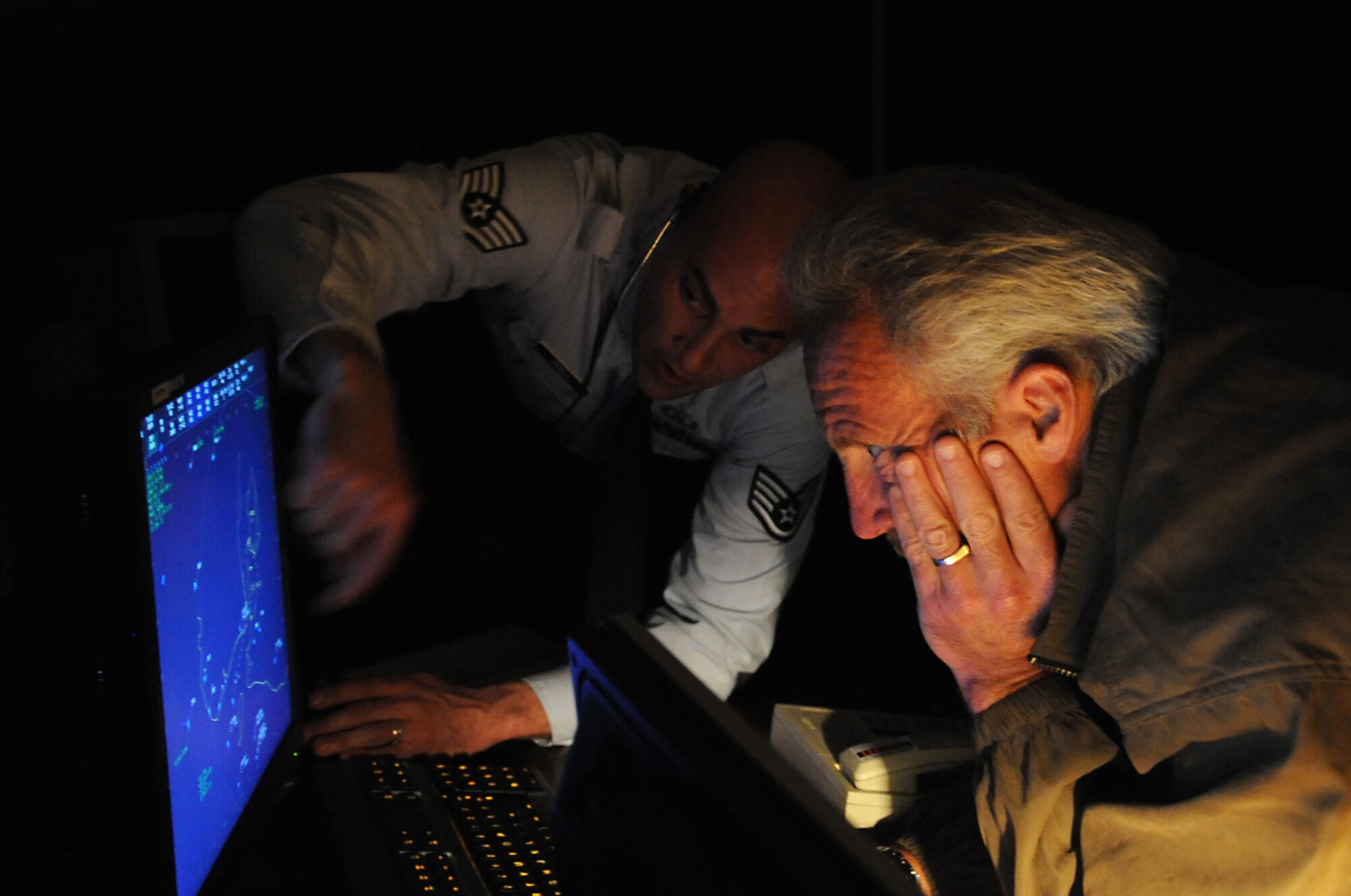 JOINT BASE ELMENDORF-RICHARDSON, Alaska -- Staff Sgt. Tyson Small shows a civic leader different air spaces and radar patterns within the Anchorage bowl area during the Chief of Staff civic leader tour Aug.9. The tour was to provide U.S.-based Chief of Staff of the Air Force civic leaders an opportunity to experience firsthand the Alaska mission across the Joint Operating Area and provide an opportunity for interaction and networking among joint service members and civic leaders. Sergeant Small is an air traffic control watch supervisor with the 3rd Operations Support Squadron. (Air Force photo by Senior Airman Cynthia Spalding) 