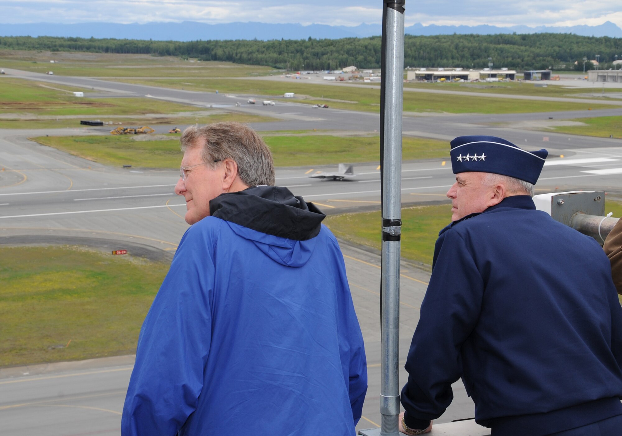 JOINT BASE ELMENDORF-RICHARDSON, Alaska -- Gen. Carrol H. "Howie" Chandler, Vice Chief of Staff of the Air Force, watches as F-22 Raptors take-off from atop the Elmendorf air control tower with civic leaders during the Chief of Staff civic leader tour August 9. The tour was to provide U.S.-based Chief of Staff of the Air Force civic leaders an opportunity to experience firsthand the Alaska mission across the Joint Operating Area and provide an opportunity for interaction and networking among joint service members and civic leaders. (Air Force photo by Senior Airman Cynthia Spalding) 