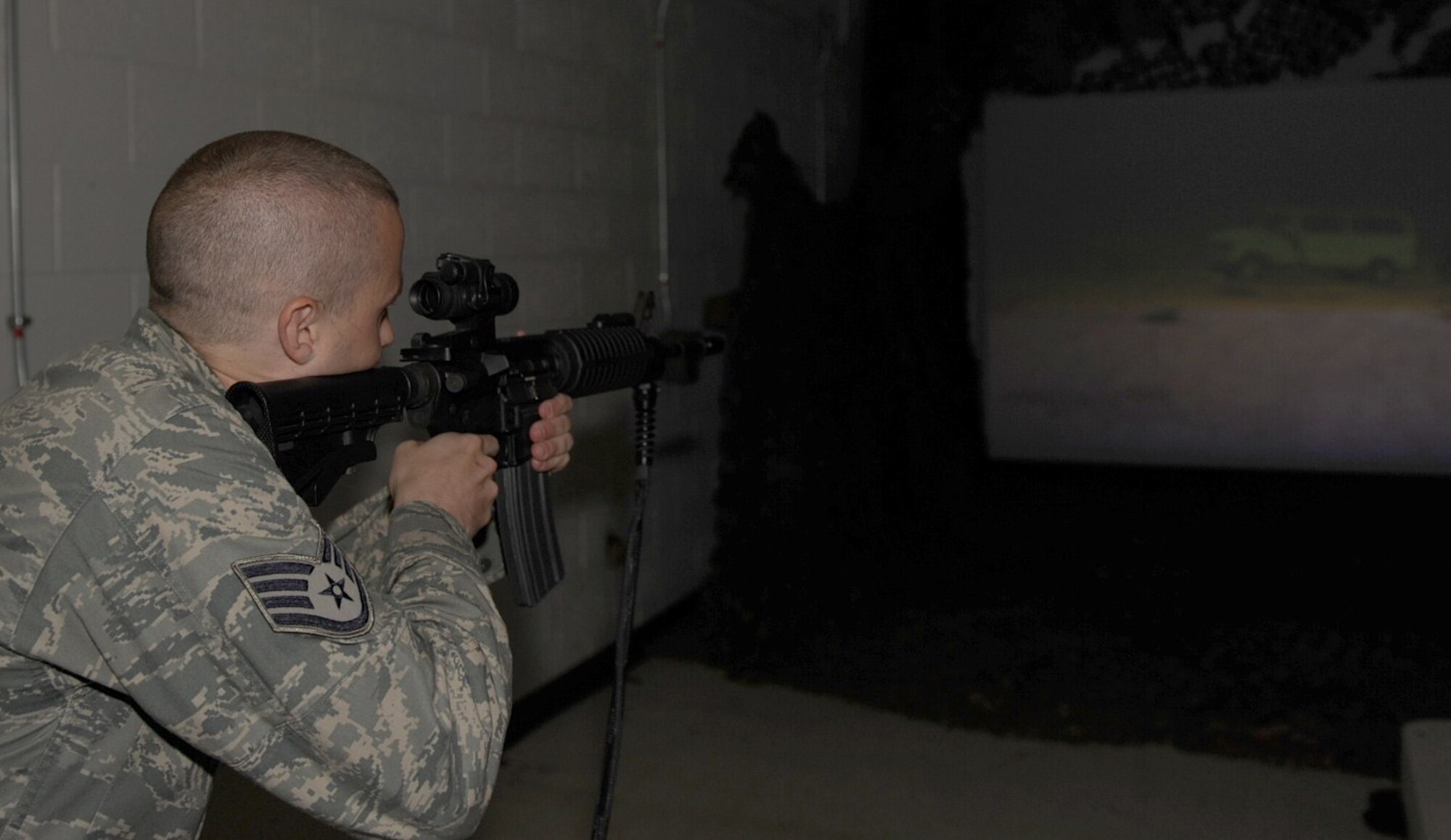 SEYMOUR JOHNSON AIR FORCE BASE, N.C. -- Staff Sgt. Jason Strickland runs through a uses of force training scenario on a simulator here Aug. 19, 2010. Trainers with the 4th SFS  training flight use a simulator to educate their students on various scenarios they may encounter on patrol at home station or while deployed. Sergeant Strickland, 4th SFS vehicle control officer, hails from Greensboro. (U.S. Air Force photo/Senior Airman Gino Reyes)