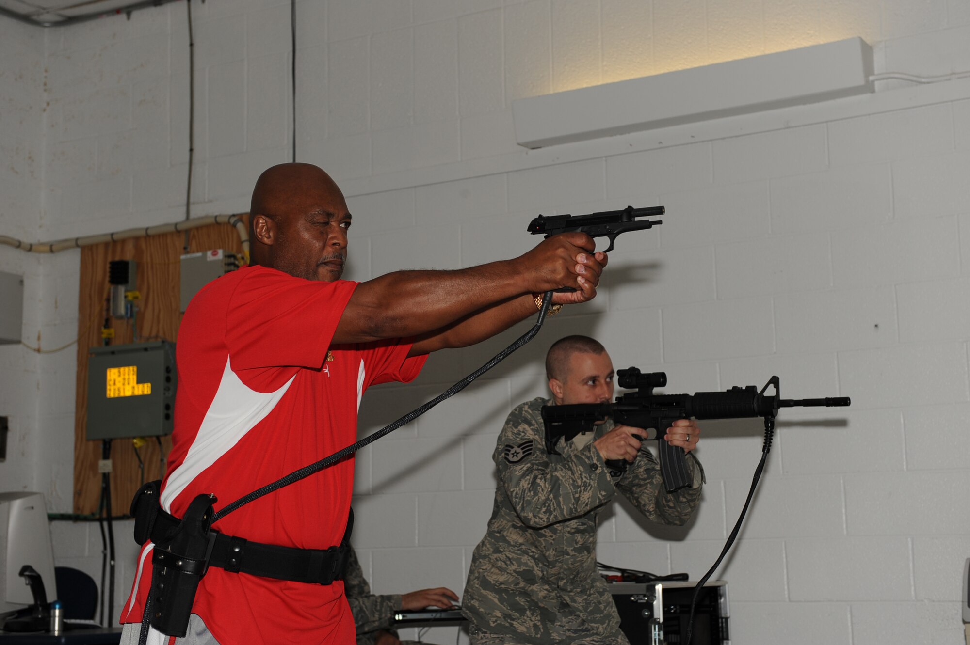 SEYMOUR JOHNSON AIR FORCE BASE, N.C. -- Staff Sgt. Jason Strickland and Wilburt Ward Jr. conduct use of force training here Aug. 19, 2010. Members of the 4th Security ForcesSquadron must participate in use of force training annually. Sergeant Strickland, 4th SFS vehicle control officer, hails from Greensboro. Mr. Ward, 4th SFS security officer, is a native of Goldsboro. (U.S. Air Force photo/Senior Airman Gino Reyes)