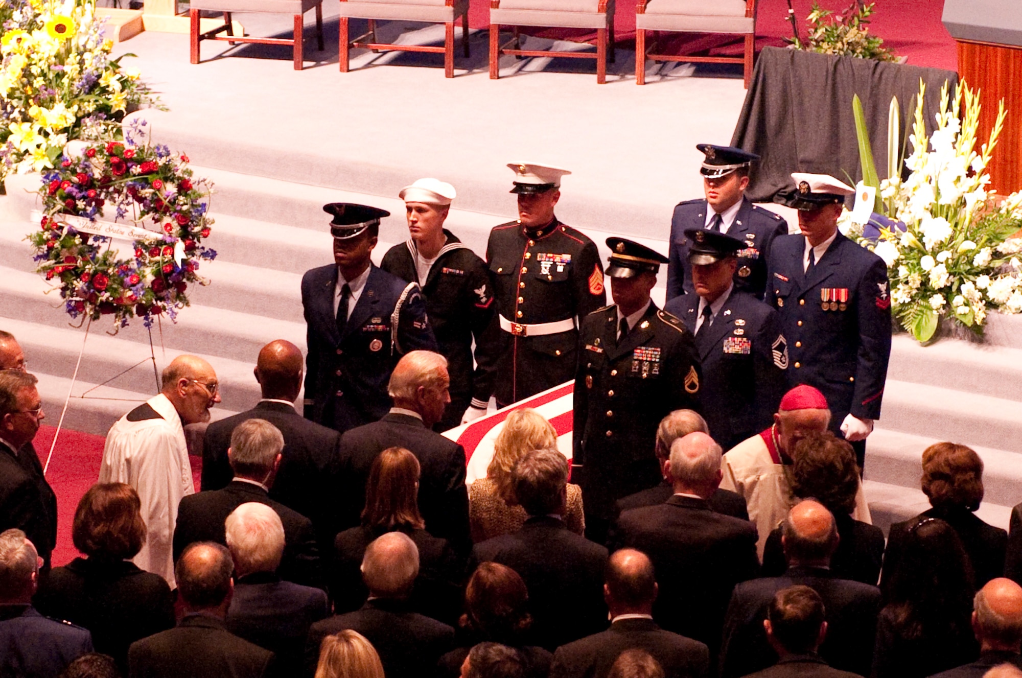 ANCHORAGE, Alaska -- A joint-military honor guard transports former Senator Ted Stevens out of the auditorium after his funeral service Aug. 18. People from the Anchorage and military community along with many political dignitaries attended the late senator's service. (Photo by Airman 1st Class Christopher Gross/JBER PAO)