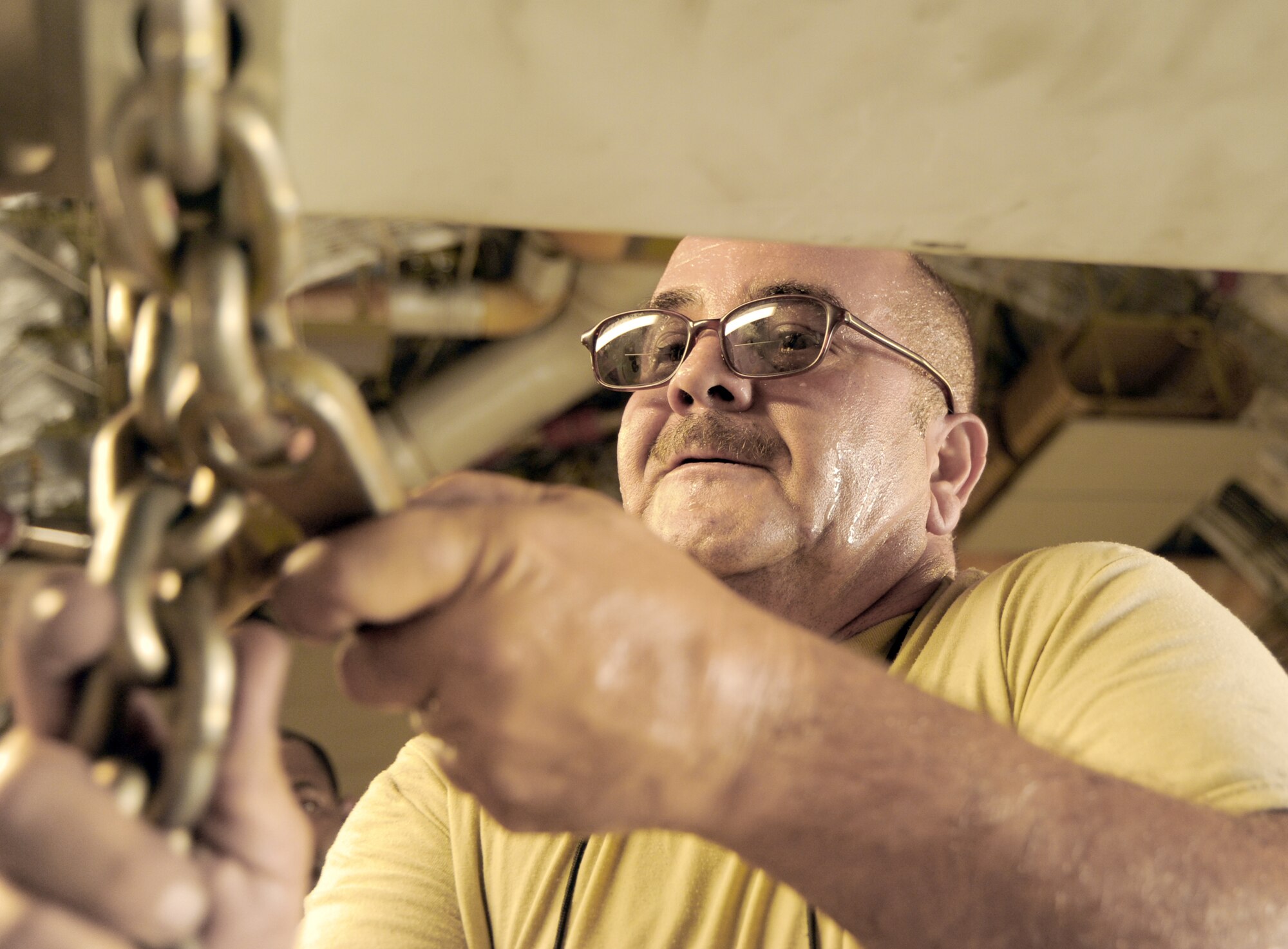 Tech. Sgt. Jose Gonzalez assists in preparing a C-17 Globemaster III prior to an airdrop mission Aug. 13, 2010, in Southwest Asia. Sergeant Gonzalez is with the 8th Expeditionary Air Mobility Squadron. (U.S. Air Force photo/Staff Sgt. Tim Jenkins)
