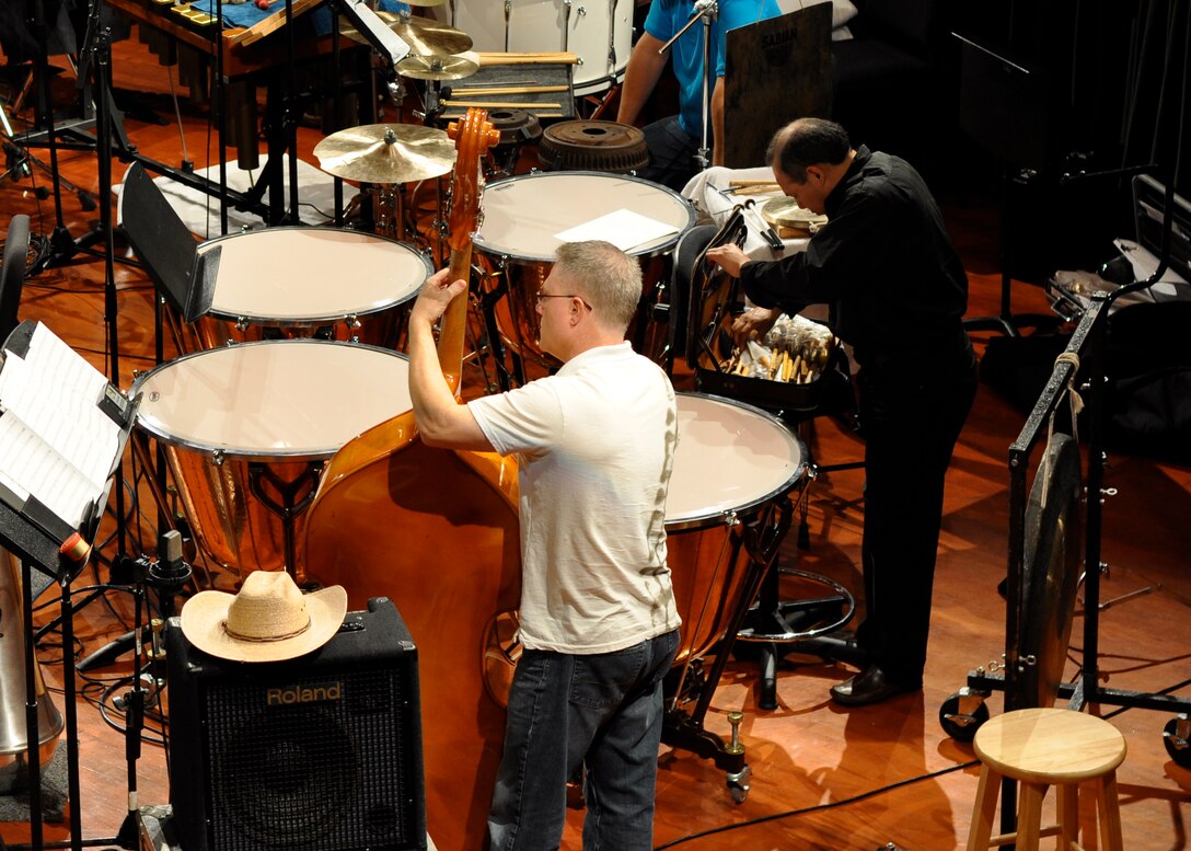 Master Sergeant Doug Bennett and Mr. Godoy warm up before the concert band recording session on John Mackey's "Turbine" begins on August 8, 2010.
