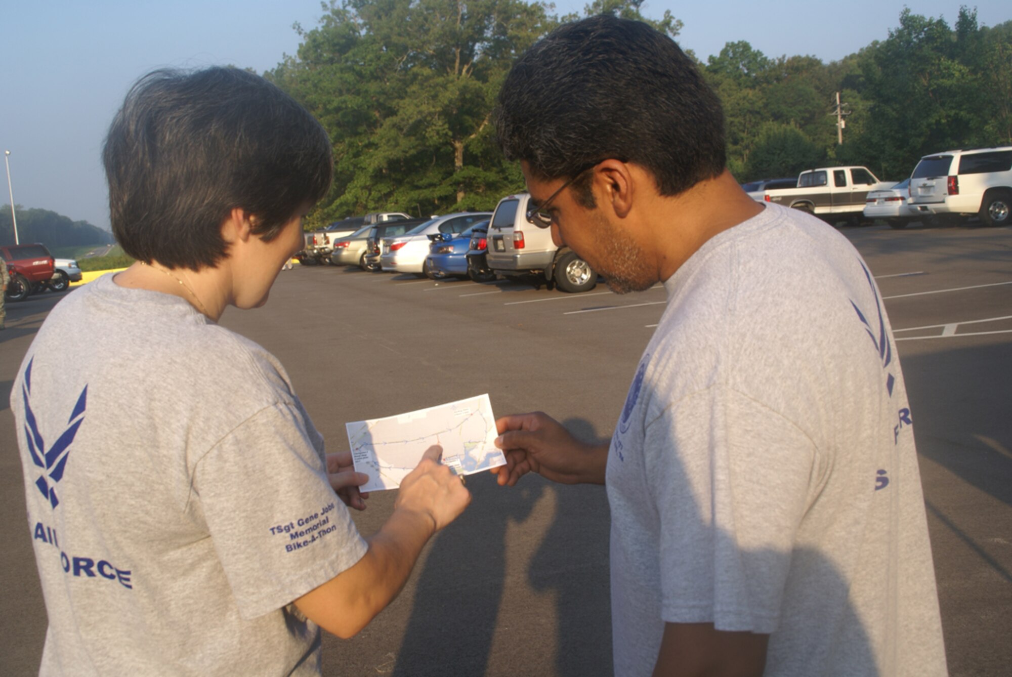 AFSA member Master Sgt (ret.) Donna Paredez, a data analyst for AEDC’s Maintenance Support Asset Branch, and her husband, Joey Paredez, who is also retired from the Air Force, review a map of the course for the bike-a-thon.