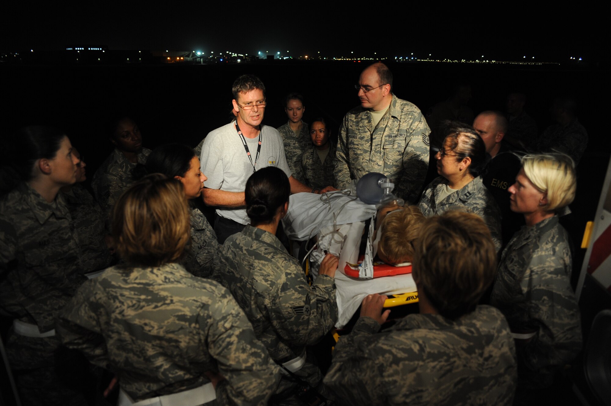 Mr. Kelvin McIver gives a briefing to the 379th Expeditionary Medical Group medics on proper procedures for preparing patients to be off loaded from an ambulance in preparation for on-loading to a Life-Flight helicopter at an undisclosed location in Southwest Asia July 28. Mr. McIver is the Lead Life Flight Paramedic. (U.S. Air Force phtoo/Senior Airman Katie Gieratz)  