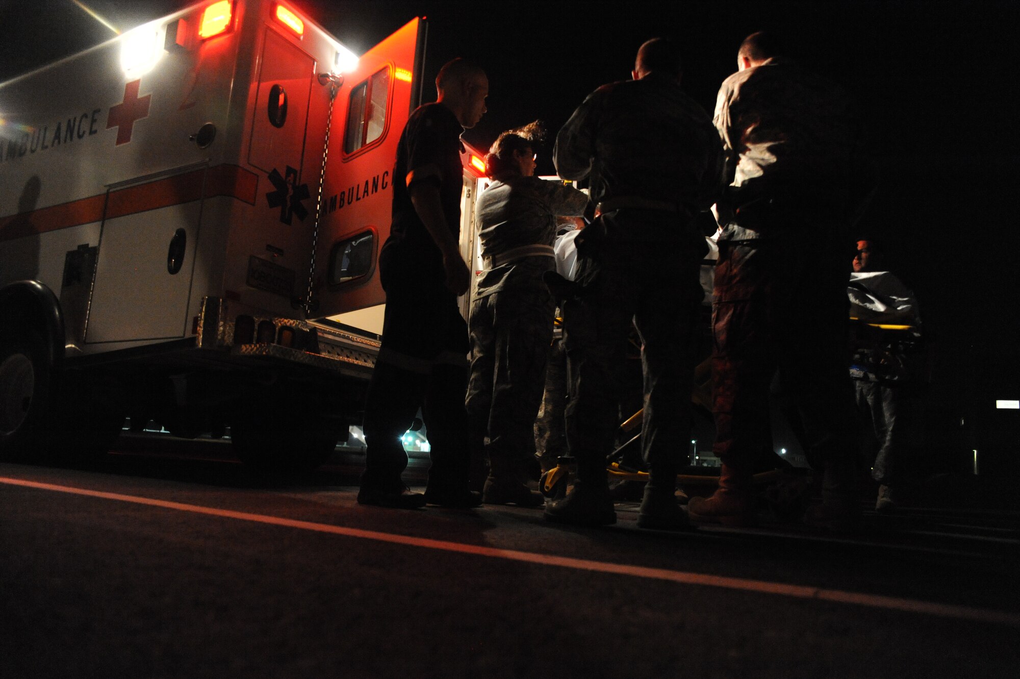 Airmen practice loading a patient onto an ambulance during training at an undisclosed location in Southwest Asia July 28. (U.S. Air Force photo/Senior Airman Katie Gieratz)  