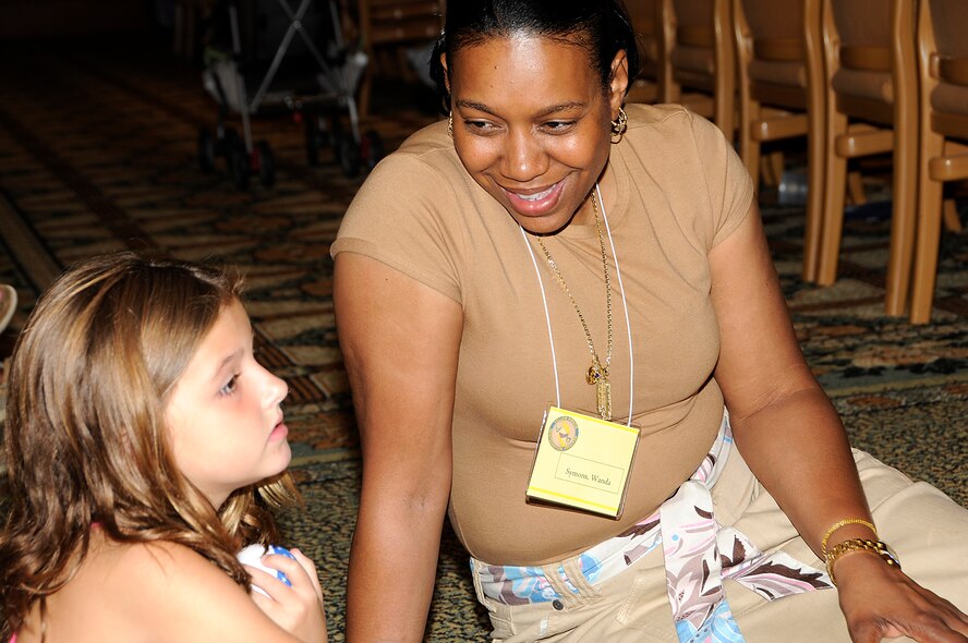 Senior Master Sgt. Wanda Symons, 482nd Fighter Wing, Homestead ARB, Fla.,  participated in the Yellow Ribbon event Aug. 14-16 at the Shades of Green resort in Disney World as a child care provider. Airmen and their families were given an opportunity to receive information about programs and services available to them while also attending various classes and sessions that dealt with issues facing deployed Airmen. Children ages 0-15 were provided with free care during the event. (U.S. Air Force photo/Senior Airman Lou Burton)