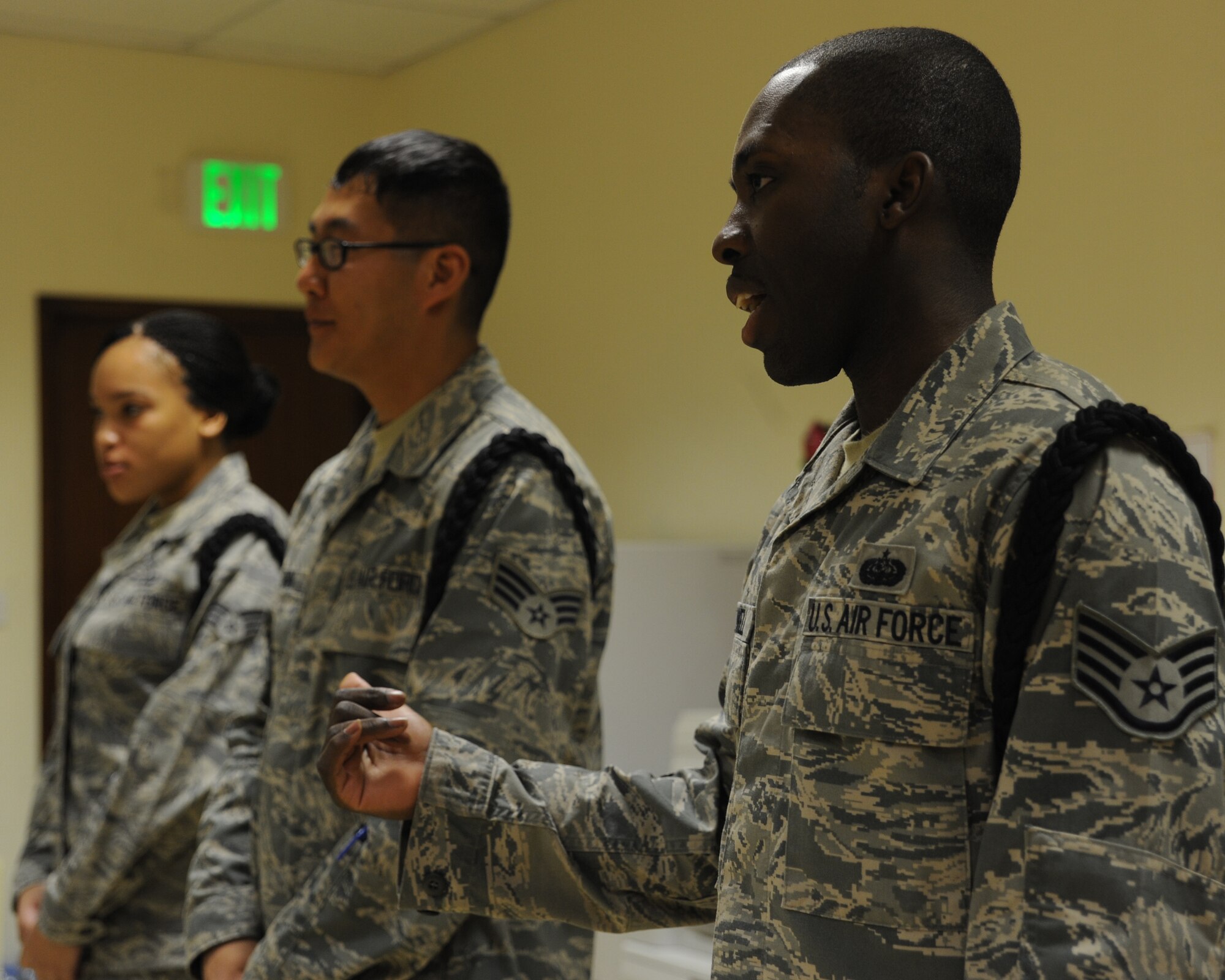 Staff Sergeant Tavarus Powell speaks to the honor Guard prior to practice at an undisclosed location in Southwest Asia August 3. Sergeant Powell is a project manager with Air Force Forces Communications and is deployed from Tinker AFB, OK. (U.S. Air Force photo/Senior Airman Katie Gieratz)