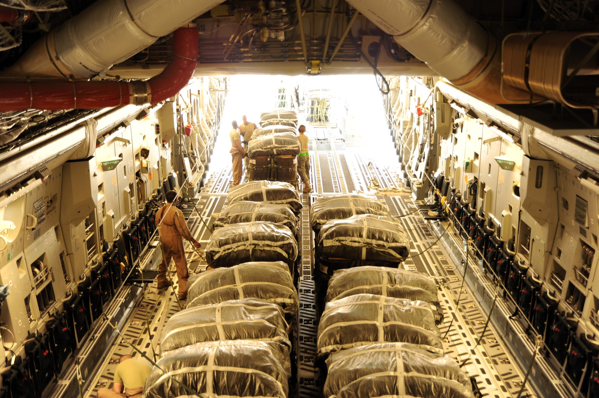 Bundles are loaded onto a C-17 Globemaster III at an undisclosed location in Southwest Asia prior to an airdrop mission Aug. 13. (U.S. Air Force photos/Staff Sgt. Tim Jenkins)