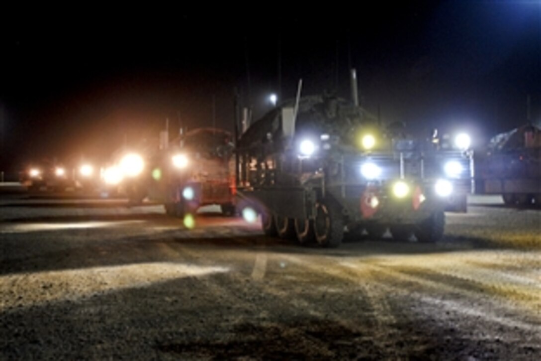 U.S. Stryker armored vehicles with the 2nd Infantry Division’s 4th Stryker Brigade Combat Team line up at a fueling site on Camp Taji, Iraq, Aug. 17, 2010, to receive fuel before heading out on a two-day mission to leave Iraq through Kuwait. 