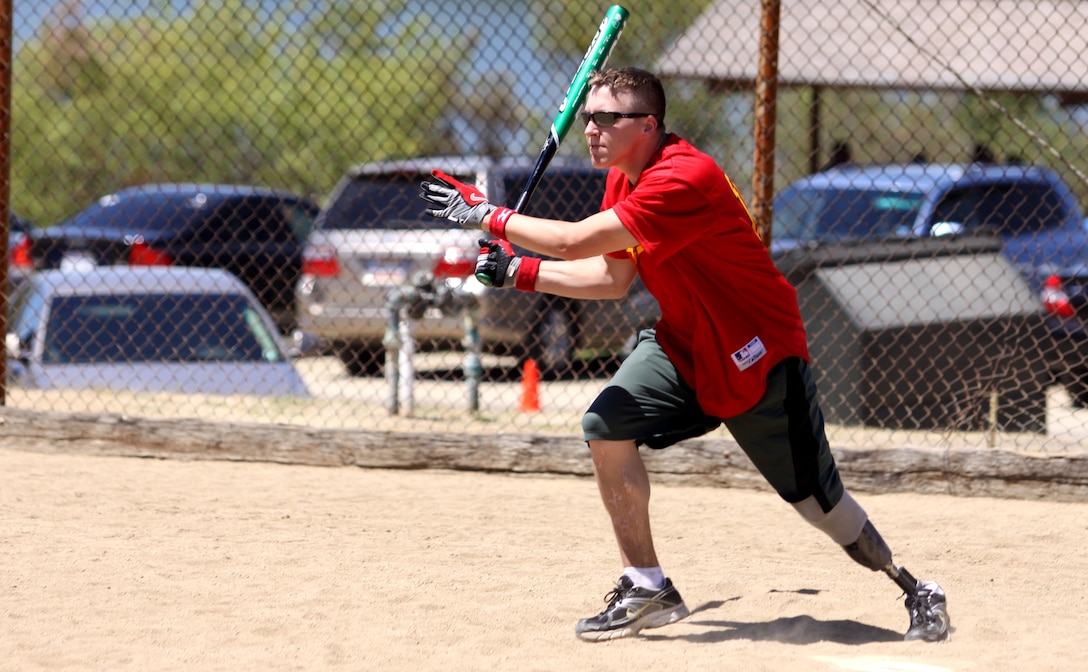 Petty Officer 3rd Class Dock Jacobs, a patient with Wounded Warrior Battalion West, Camp Pendleton, takes off running after he makes a hit during a softball game. November is designated as Warrior Care Month to honor those who were wounded, injured or became ill while defending our country. This year’s theme is “Focusing on Abilities- Supporting Wounded Warrior throughout their Recovery, Rehabilitation, and Reintegration.” Programs that assist with non-medical issues such as pay, travel, housing, transportation, education and athletics, are highlighted during this month.