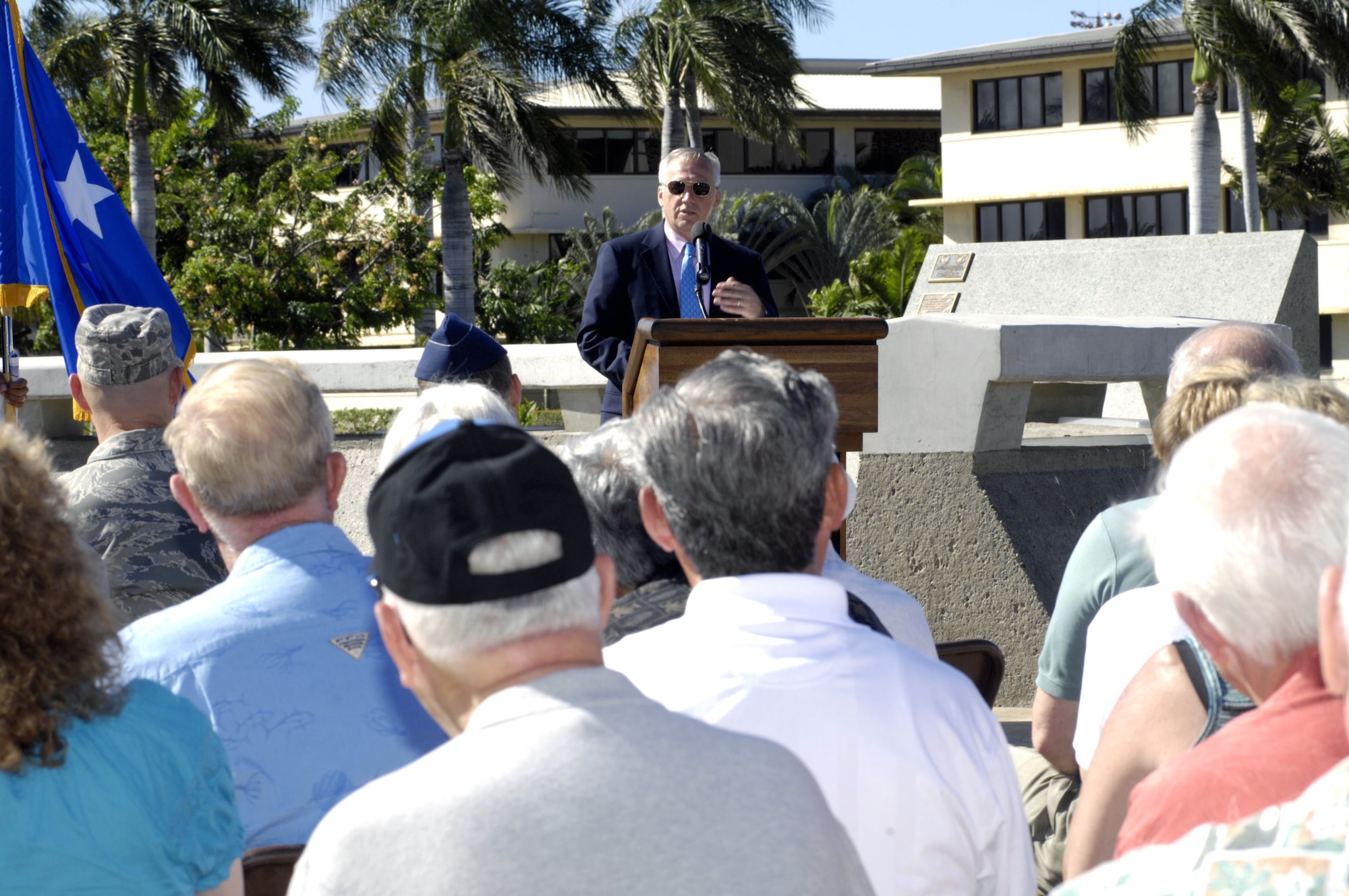 Retired General Bruce Carlson, Director, National Reconnaissance Office speaks to attendees of the plaque dedication ceremony commemorating the 50th anniversary of the "Catch a Falling Star" mission Aug. 19 at Joint Base Pearl Harbor Hickam, Hawaii.  The 6549th Test Group and 6593rd Test Squadron were responsible for the recovery of re-entry capsules in support of the National Reconnaissance Office's Corona program. (U.S. Air Force photo by David D. Underwood, Jr.)