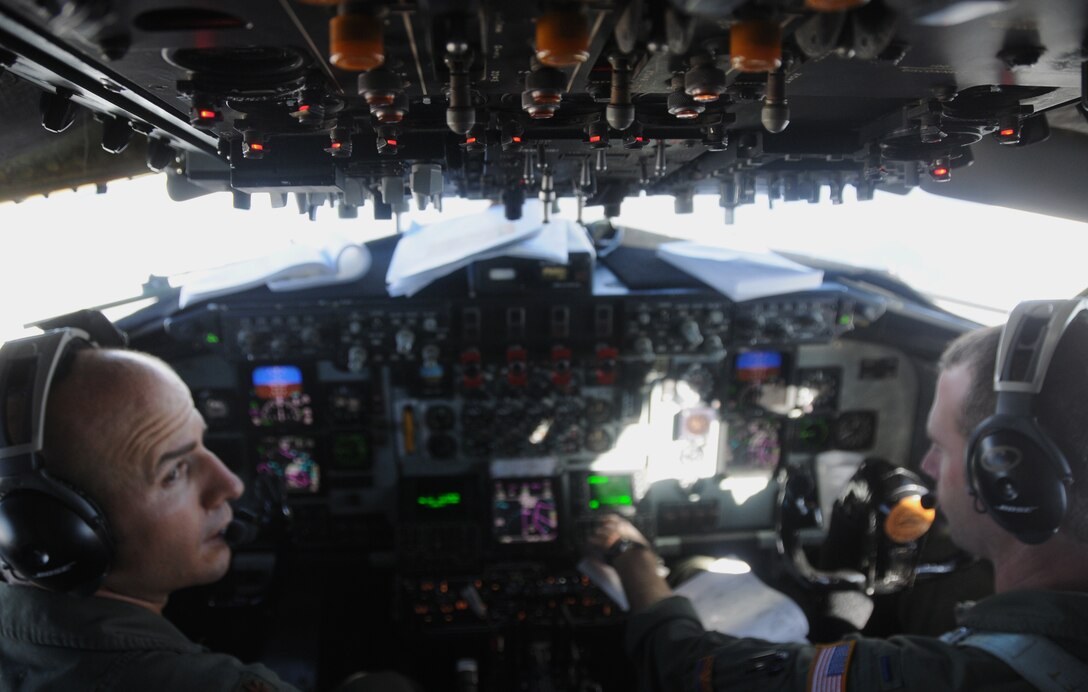 U.S. Air Force pilots, Major Dusty Benker and First Lieutenant Nate Preston of the161st Operations Group, perform checklist steps during an aerial refueling mission over the Pacific Ocean, August 18, 2010. The 161st Air Refueling Wing KC-135s refueled three Hawaii Air National Guard F-15s on their way to Nellis Air Force Base. (U.S. Air Force Photo by Senior Airman Nicole Enos)
