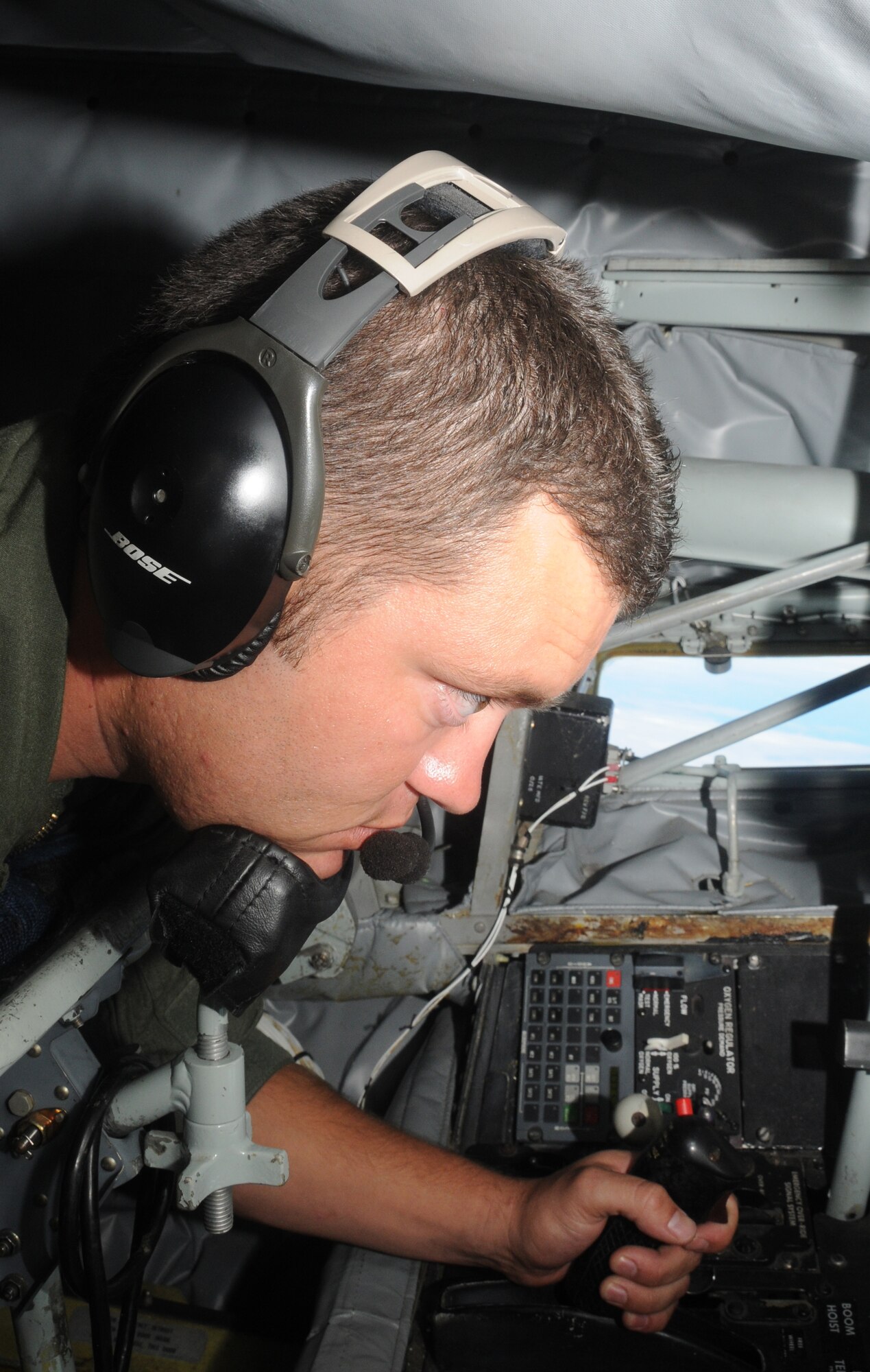 U.S. Air Force Staff Sgt. Johnny Estrada, 161st Operations Group boom operator, performs checklist steps during an aerial refueling mission over the Pacific Ocean, August 18, 2010. The 161st Air Refueling Wing KC-135s refueled three Hawaii Air National Guard F-15s on their way to Nellis Air Force Base. (U.S. Air Force Photo by Senior Airman Nicole Enos)
