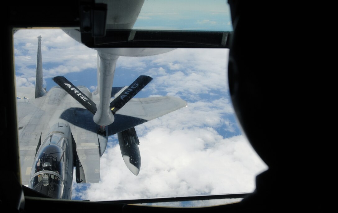 A KC-135 from the 161st Air Refueling Wing refuels an F-15 from the Hawaii Air National Guard during an aerial refueling mission over the Pacific Ocean, August 18, 2010. The KC-135 refueled three F-15s on their way to Nellis Air Force Base. (U.S. Air Force Photo by Senior Airman Nicole Enos)
