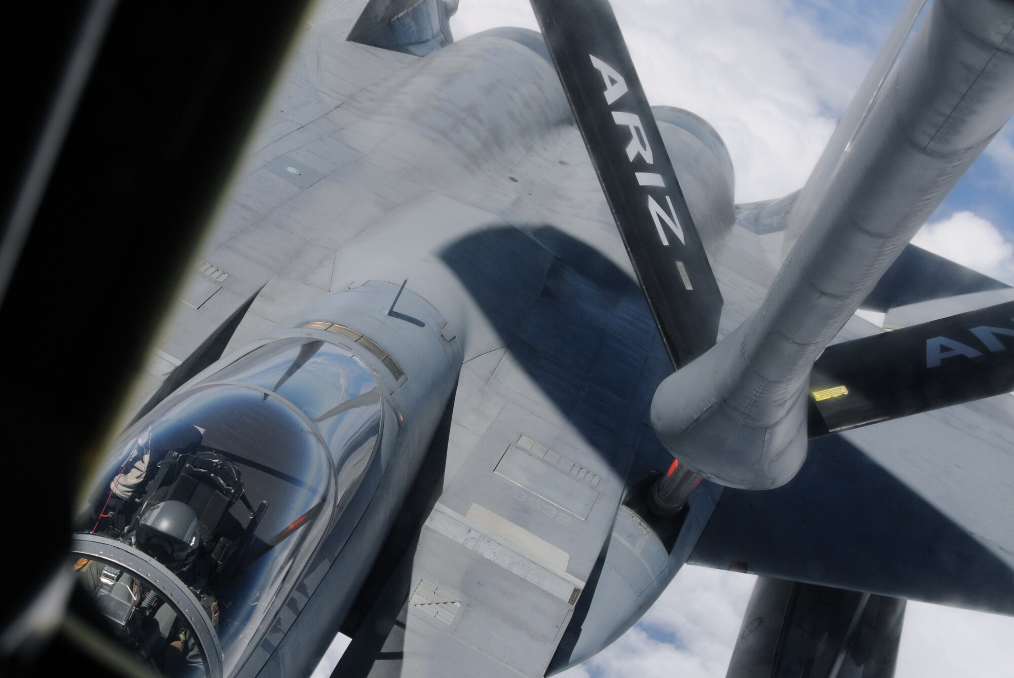 A KC-135 from the 161st Air Refueling Wing refuels an F-15 from the Hawaii Air National Guard during an aerial refueling mission over the Pacific Ocean, August 18, 2010. The KC-135 refueled three F-15s on their way to Nellis Air Force Base. (U.S. Air Force Photo by Senior Airman Nicole Enos)
