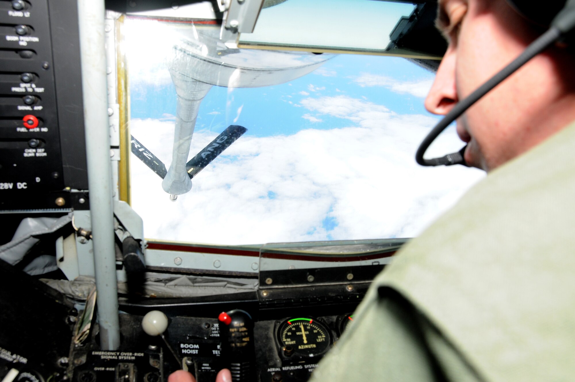 U.S. Air Force Staff Sgt. Kyle Davidson, 161st Operations Group boom operator, drops the boom of the KC-135 during an aerial refueling mission over the Pacific Ocean, August 18, 2010. The 161st Air Refueling Wing KC-135s refueled three Hawaii Air National Guard F-15s on their way to Nellis Air Force Base. (U.S. Air Force Photo by Senior Airman Nicole Enos)
