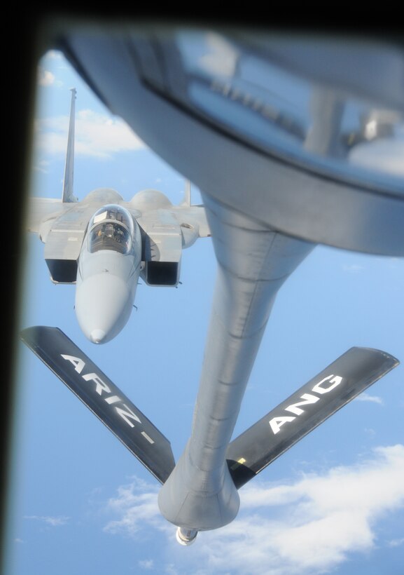 A KC-135 from the 161st Air Refueling Wing prepares to refuel an F-15 from the Hawaii Air National Guard during an aerial refueling mission over the Pacific Ocean, August 18, 2010. The KC-135 refueled three F-15s on their way to Nellis Air Force Base. (U.S. Air Force Photo by Senior Airman Nicole Enos)
