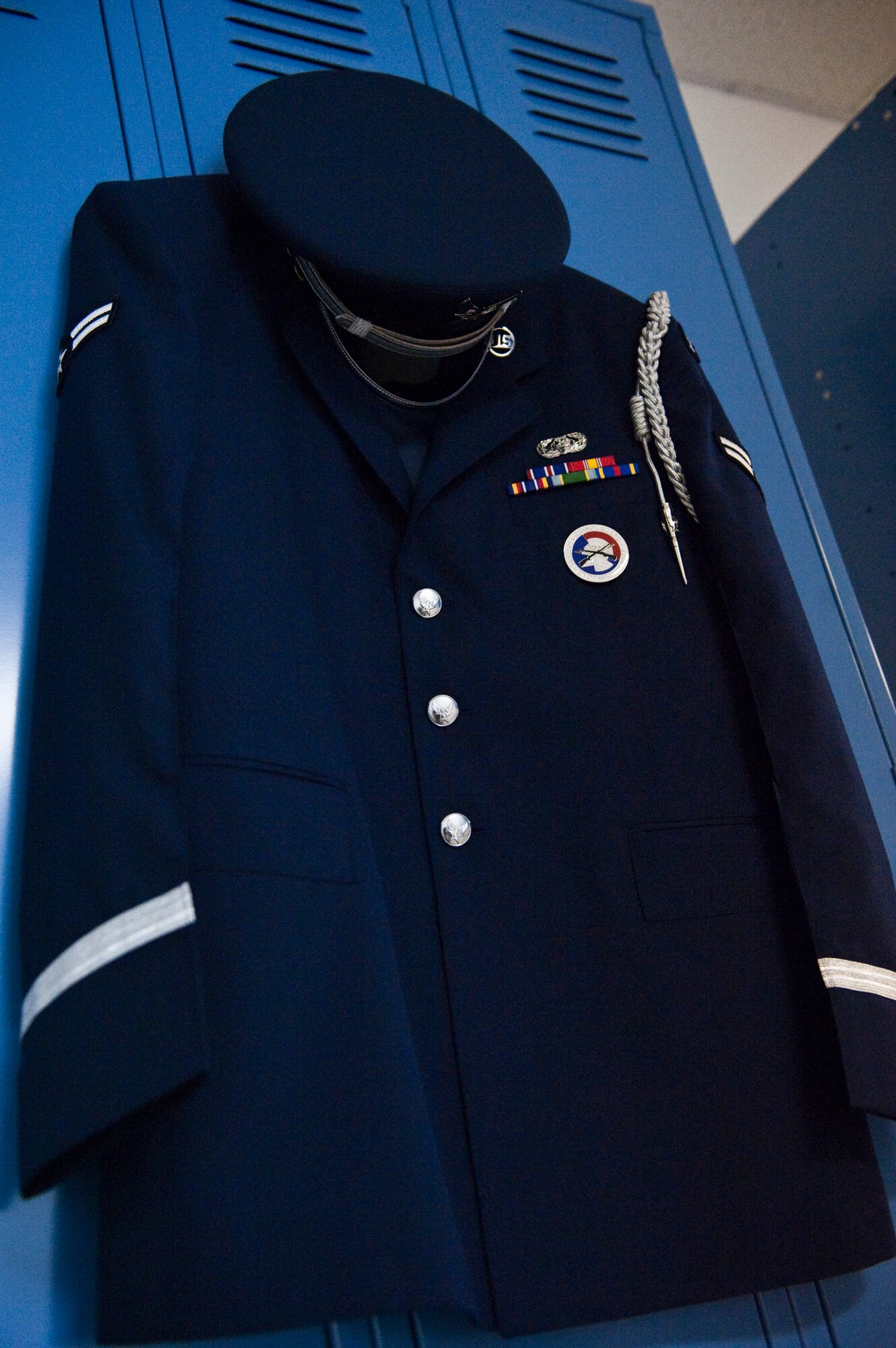 JOINT BASE ELMENDORF-RICHARDSON, Alaska -- Airman 1st Class Royce Williams' honor guard attire hangs on his wall locker at Joint Base Elmendorf-Richardson. Airman Williams had the privilege of escorting the body of the late Alaska Sen. Ted Stevens during his viewing and memorial service Aug. 17 and 18. Airman Williams said it was an honor to have taken part in such a historic event in our nation's history. (Photo by Airman 1st Class Christopher Gross/JBER PAO)