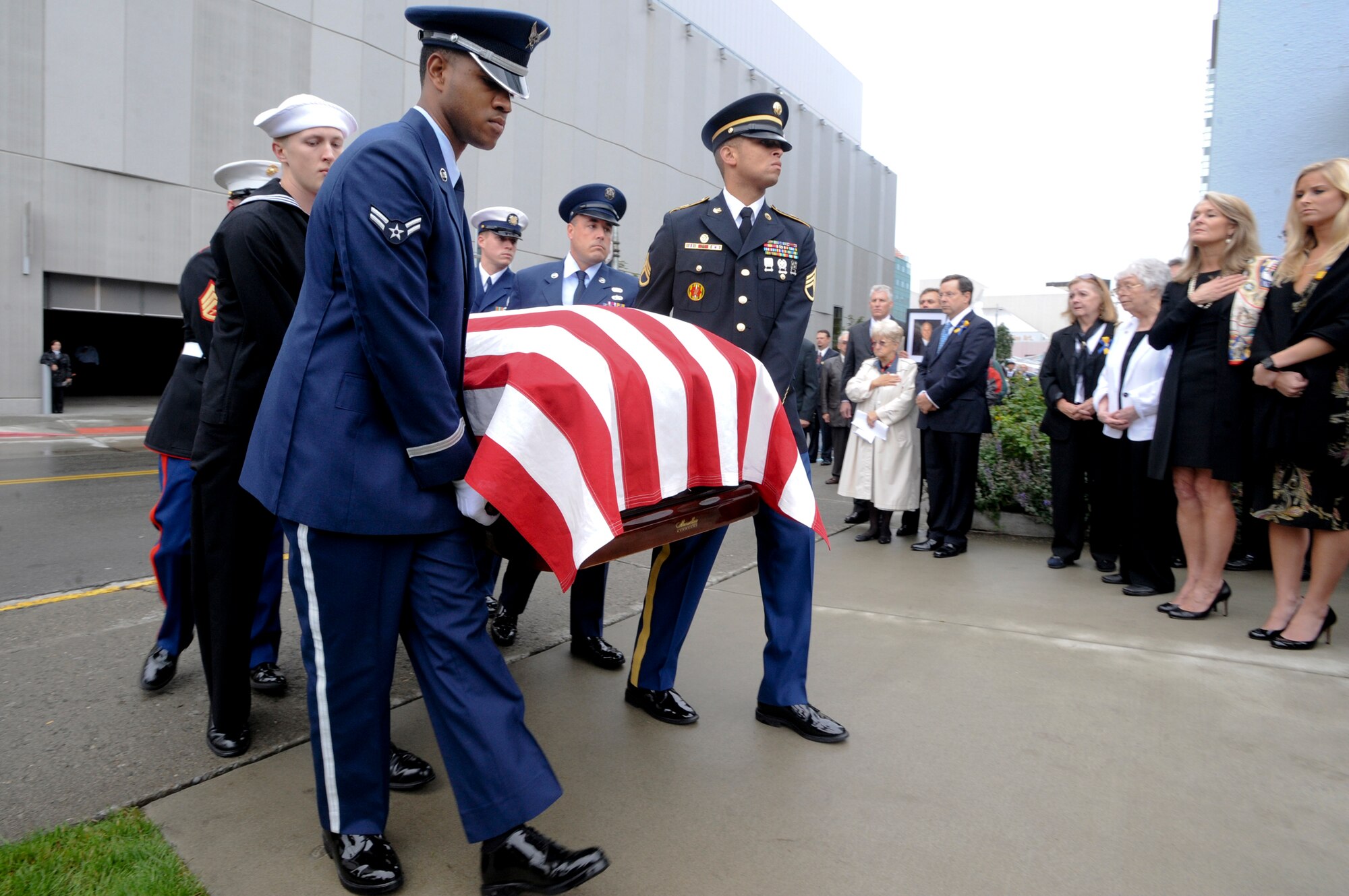 ANCHORAGE, Alaska -- Airman 1st Class Royce Williams, front right, part of a joint honor guard, escorts the remains of former Alaska Sen. Ted Stevens to the public viewing at All Saints Episcopal Church, Aug. 17. The body was later moved to the Anchorage Baptist Temple for a memorial service Aug. 18. Airman Williams said it was an honor to have taken part in such a historic event in our nation's history. (Photo by Air Force Staff Sgt. Joshua Garcia/JBER PAO)