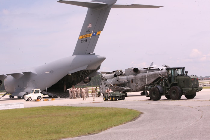 Marines and Airmen load a CH-53E Super Stallion helicopter onto a Charleston based C-17 Globemaster III aircraft at Marine Corps Air Station Cherry Point, N.C., Aug. 20. The Marines are deploying in conjunction with the 26th Marine Expeditionary Unit which is set to provide humanitarian relief to the flood victims of Pakistan. (U.S. Marine Corps photo/Lance Cpl. Brian Jones)