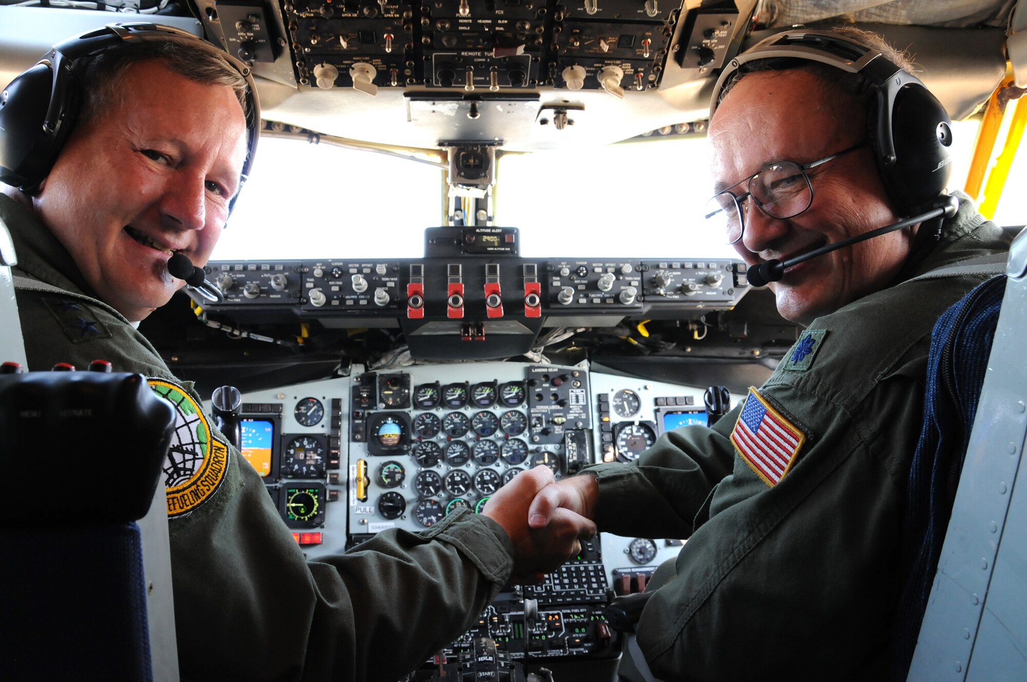 JOINT BASE ANDREWS, Md. -- Maj. Gen. Frederick F. Roggero (left) Air Force chief of safety, poses for a photograph before piloting his final flight aboard a KC-135R "Stratotanker" from the 459th Air Refueling Wing, here Aug. 20. General Roggero is retiring after 34 years of military service. General Roggero previously flew the KC-135R in 1983 at March Air Reserve Base, Calif., for the 22nd Air Refueling Squadron. His co-pilot at that time was Lt. Col. Kenneth Harris, 459th Operations Support Flight, who also flew with General Roggero on the final flight here. (U.S. Air Force photo/Tech Sgt. Steve Lewis)