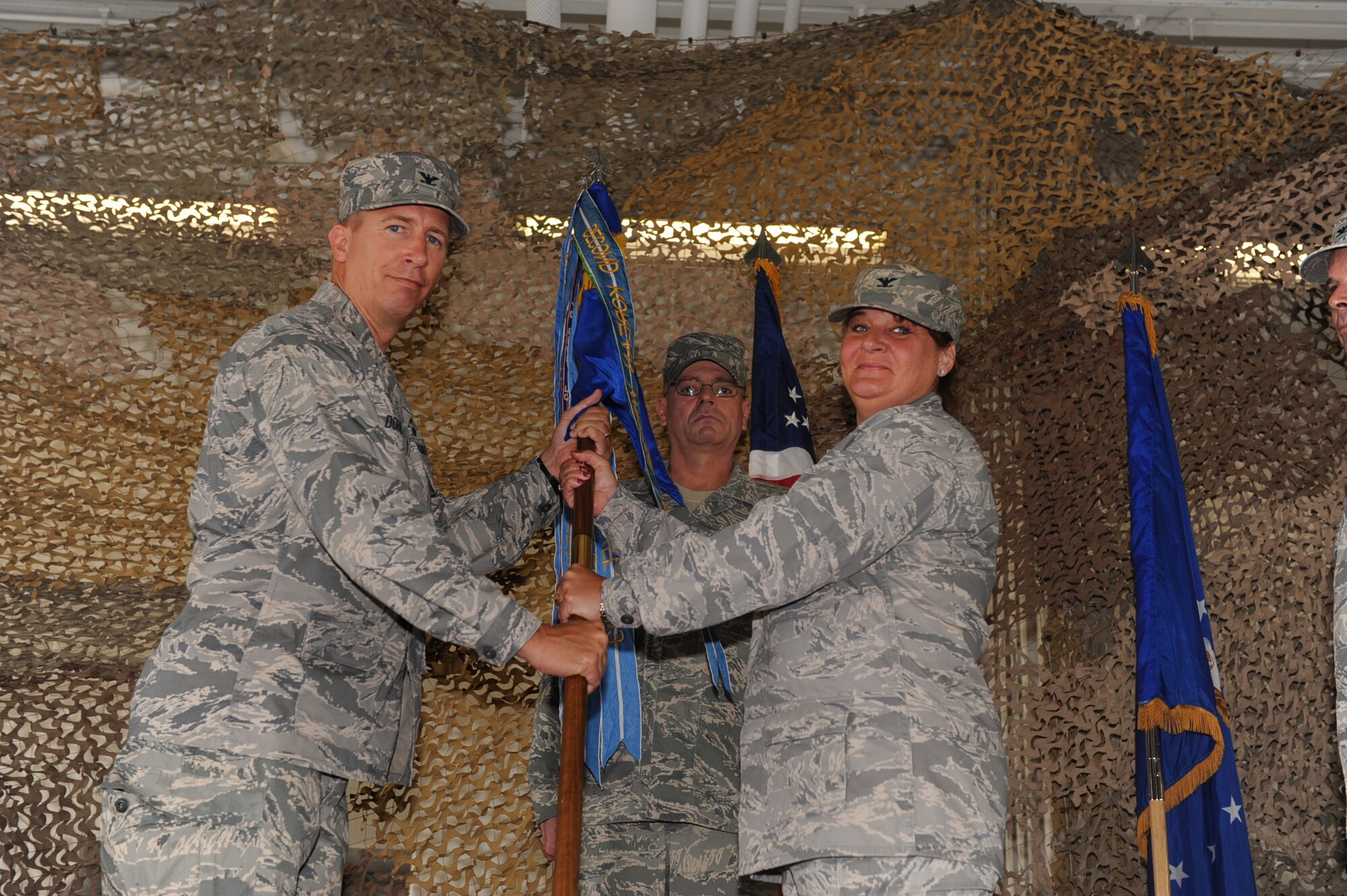 SEYMOUR JOHNSON AIR FORCE BASE, N.C. -- Col. Anne Winkler accepts command of the 4th Mission Support Group from Col. Patrick Doherty here July 12, 2010. The 4th Mission Support Group commander is responsible for the leadership and management of civil engineering, communications-computer systems support, security and law enforcement, supply, transportation, personnel, information management, education, food services, housing and recreation for a community of more than 13,000 people. Colonel Doherty is the 4th Fighter Wing commander. (U.S. Air Force photo)
