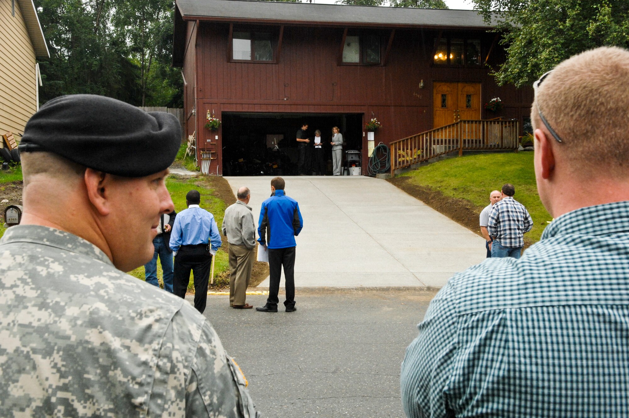 JOINT BASE ELMENDORF-RICHARDSON, Alaska -- Sgt. 1st Class David Waite admires his newly refurbished home after the ribbon cutting ceremony Aug. 12. Sergeant Waite, is a wounded warrior and recipient of the first Alaskan Operation Opening Doors project, which spent over $40,000 worth of donated supplies and man-hours to improve Sergeant Waite's home to better accomidate his disabilities. (Air Force photo by Airman 1st Class Jack Sanders)
