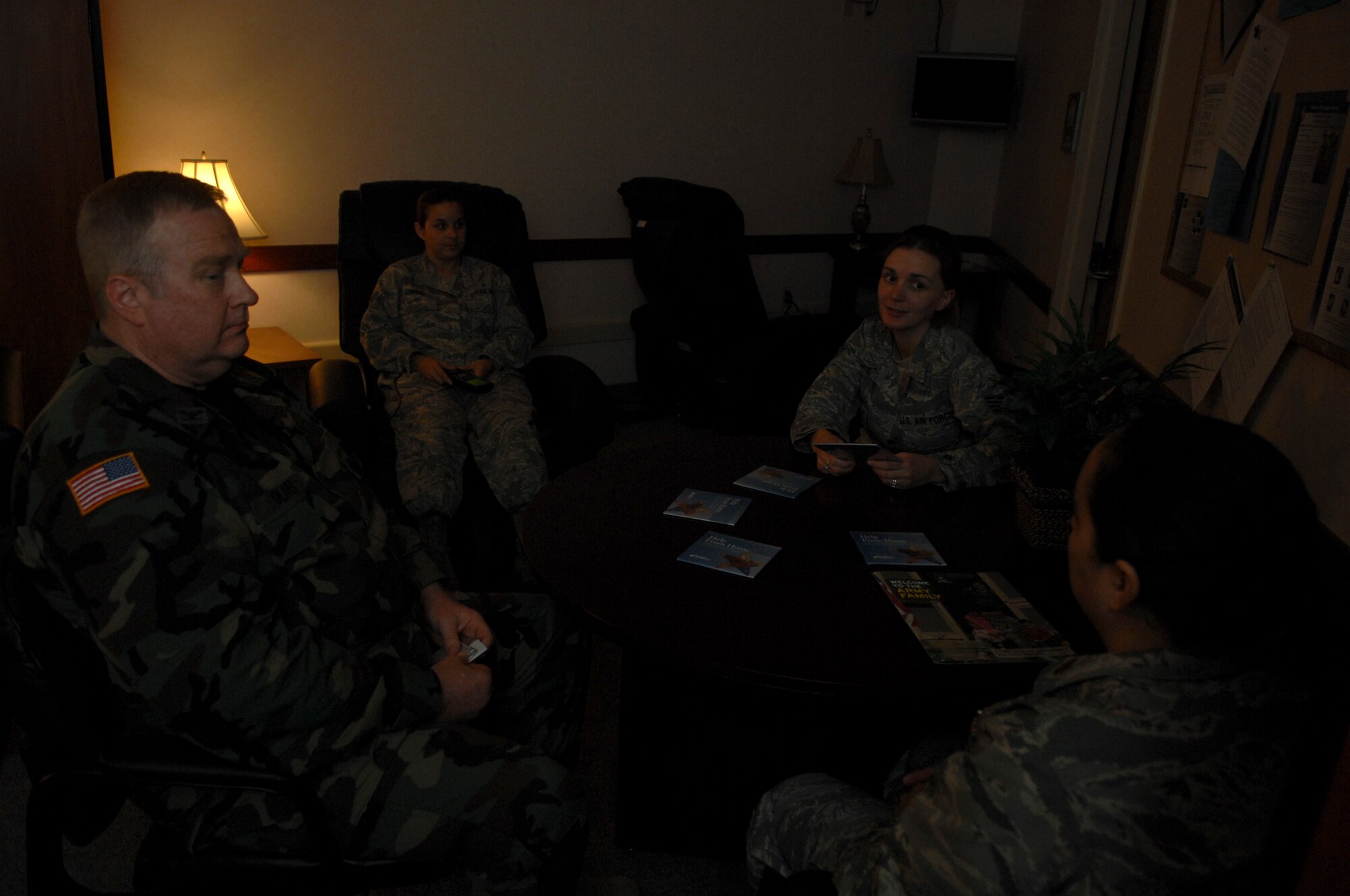 JOINT BASE ELMENDORF-RICHARDSON, Alaska -- Members of the 3rd Medical Group, Mental Health Flight, sit for a discussion in the Tramatic Brain Clinic waiting room. The TBI clinic waiting room is dimly lit to reduce stress from light sensitivity that many patients with TBI have. Mental Health deals with any mental health issue working with most Air Force organizations. (Air Force photo by Airman 1st Class Jack Sanders)