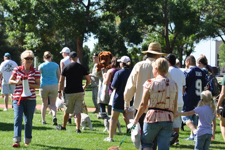 The 21st Force Support Squadron hosted the first Dog Days of Summer Dog Walk Aug. 14 at Peterson Air Force Base’s Eagle Park.  Participants enjoyed food, free treats, prizes, valuable training and adoption information, free photos and giveaways from sponsors. (U.S. Air Force photo/Jennifer Brite) 