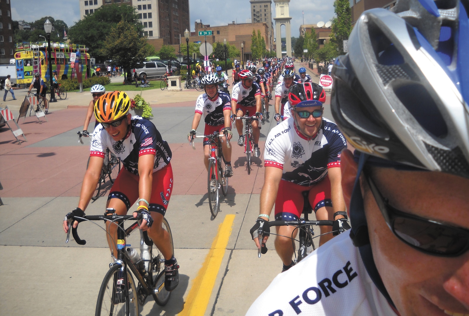 The pack of Texas' members of the Air Force Cycling team ride two-by-two into Dubuque, Iowa - the last stop at the Register's Annual Great Bicycle Ride Across Iowa, on July 31. (U.S. Air Force photo/Daniel Lunsford)