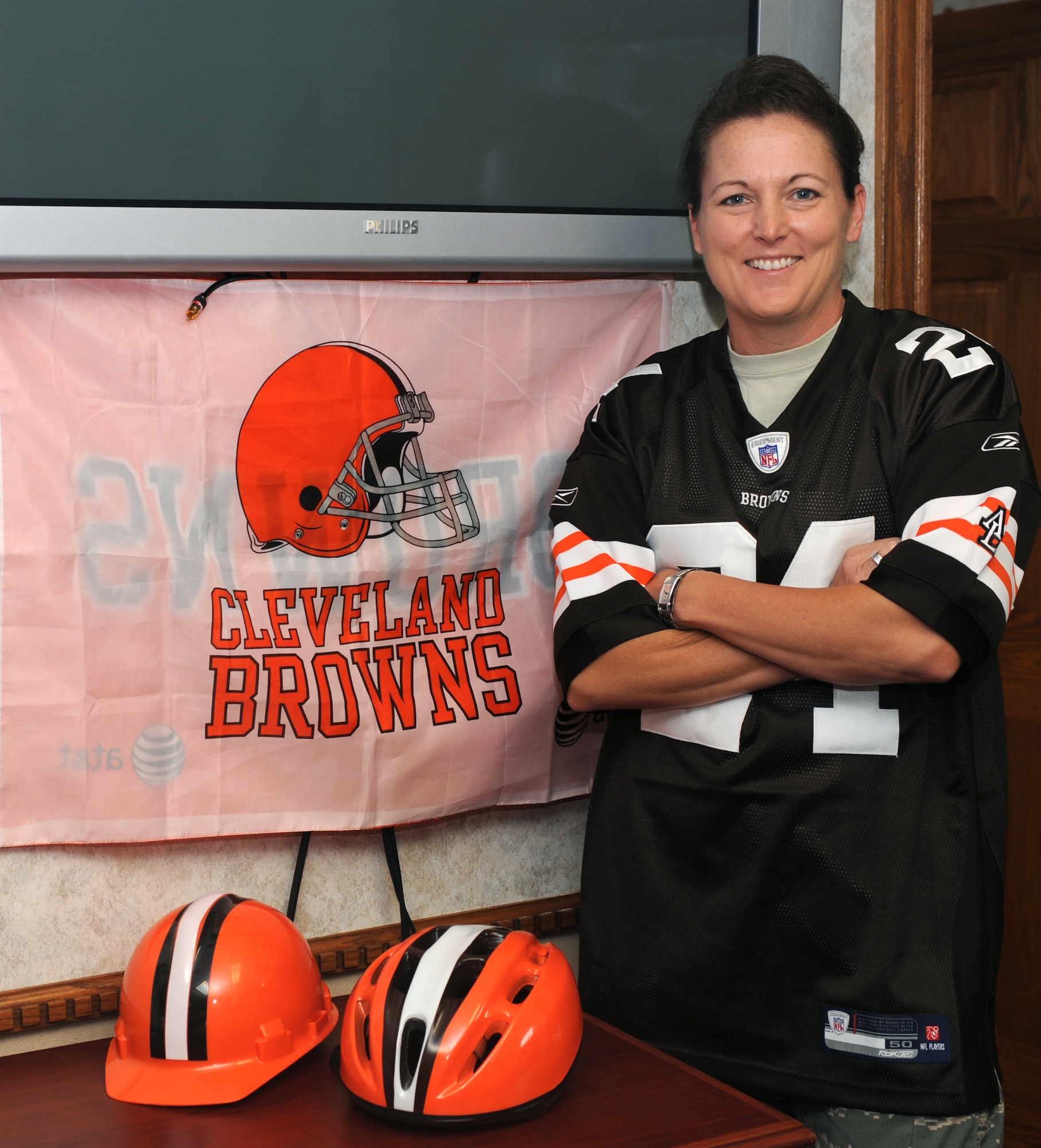 Col. Tammy Knierim, 319th Mission Support Group commander, poses for a photo in her office while wearing a Cleveland Browns’ jersey Aug. 20 on Grand Forks Air Force Base, N.D. (U.S. Air Force photo by Staff Sgt. Suellyn F. Nuckolls)