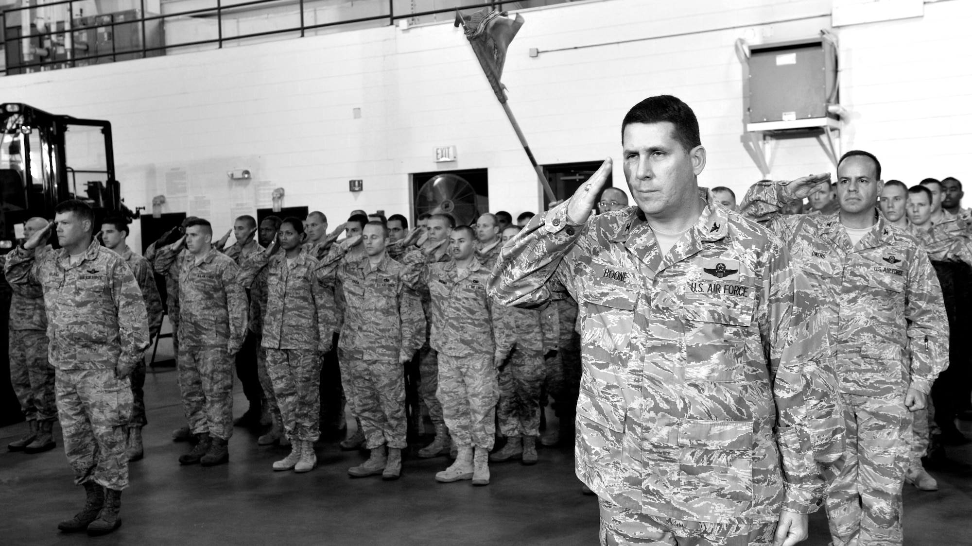 JOINT BASE MCGUIRE-DIX-LAKEHURST, N.J. - Col. Keith Boone, 621st Contingency Response Wing vice commander, leads the unit in their first salute to Col. Chris Patterson, 621st Contingency Response Wing commander during a change of command ceremony here Aug. 18. Col. Patterson assumed command of the unit which is responsible for training and rapidly deploying personnel to quickly open airfields in remote locations, the 621st CRW extends Air Mobility Command's ability to deploy people and equipment around the globe. (U.S. Air Force photo by Tech. Sgt. Laura K. Deckman)(released)