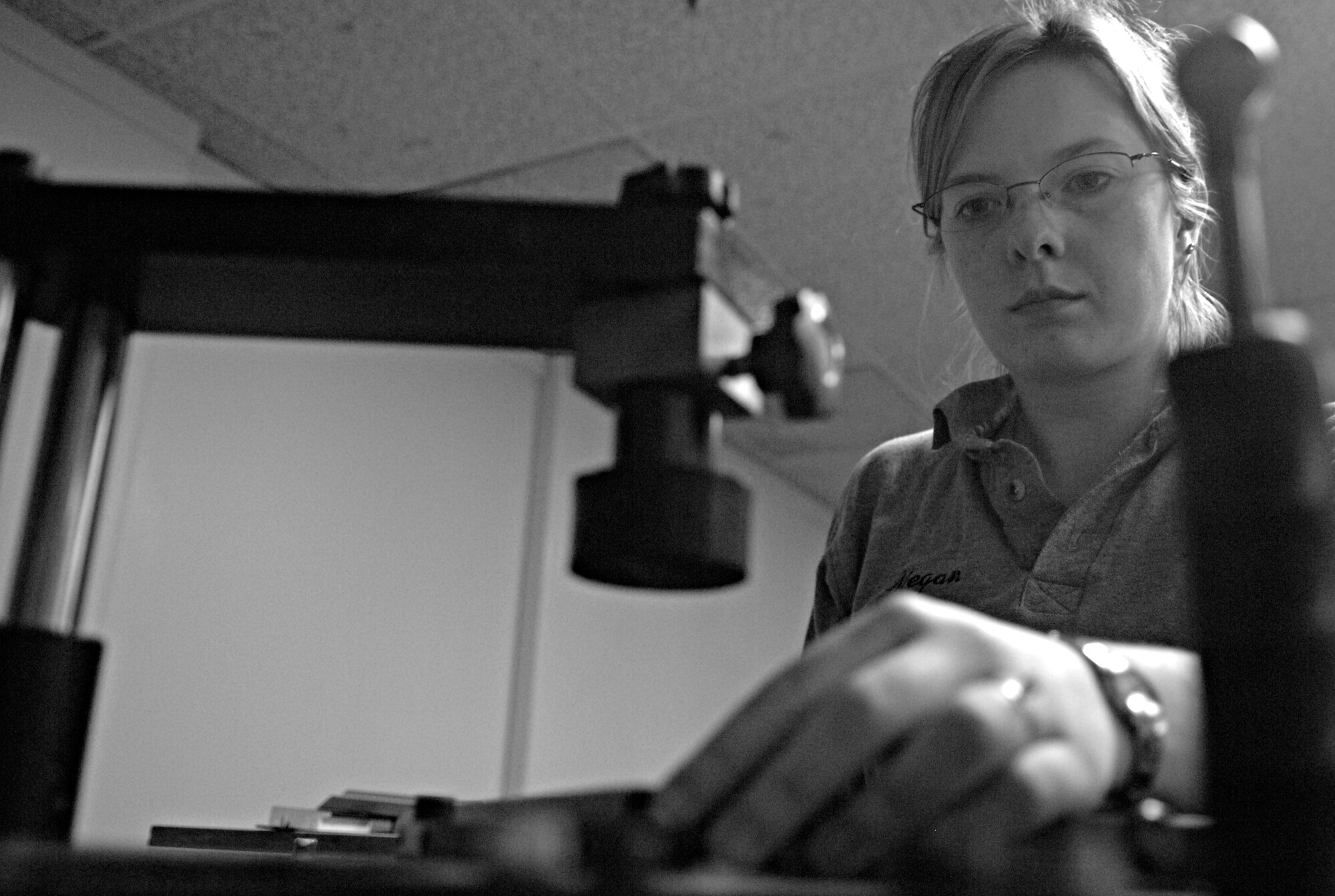 RAF MILDENHALL, England – Megan Wellentin, Arts and Crafts Center framer, staples frame sections together with an under-pinner Aug 20. The Arts and Crafts Center offers many services to include framing, embroidering, engraving and more.  (U.S. Air Force photo/Senior Airman Ethan Morgan)